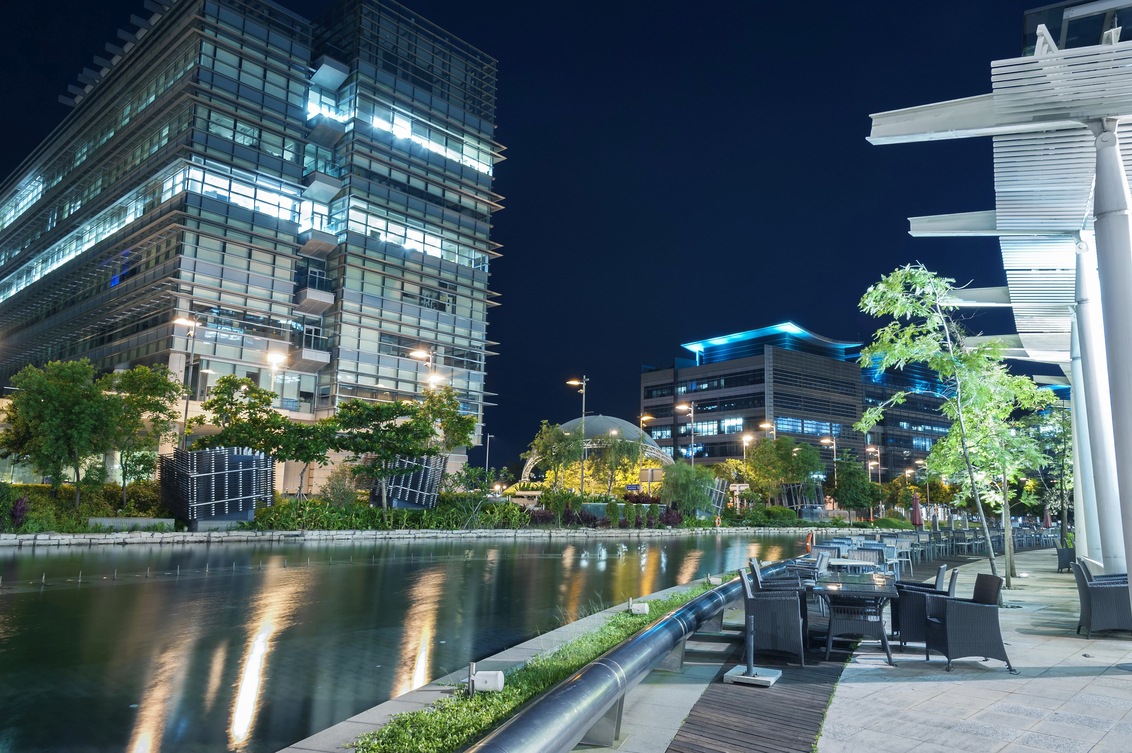 Modern buildings and river at night HD Wallpaper