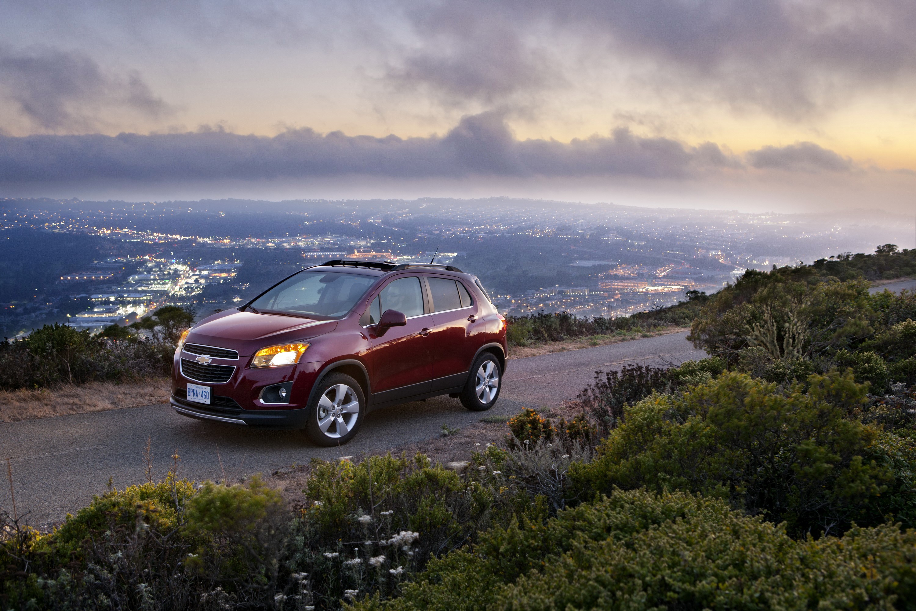 Chevrolet Trax on a scenic overlook at dusk HD Wallpaper