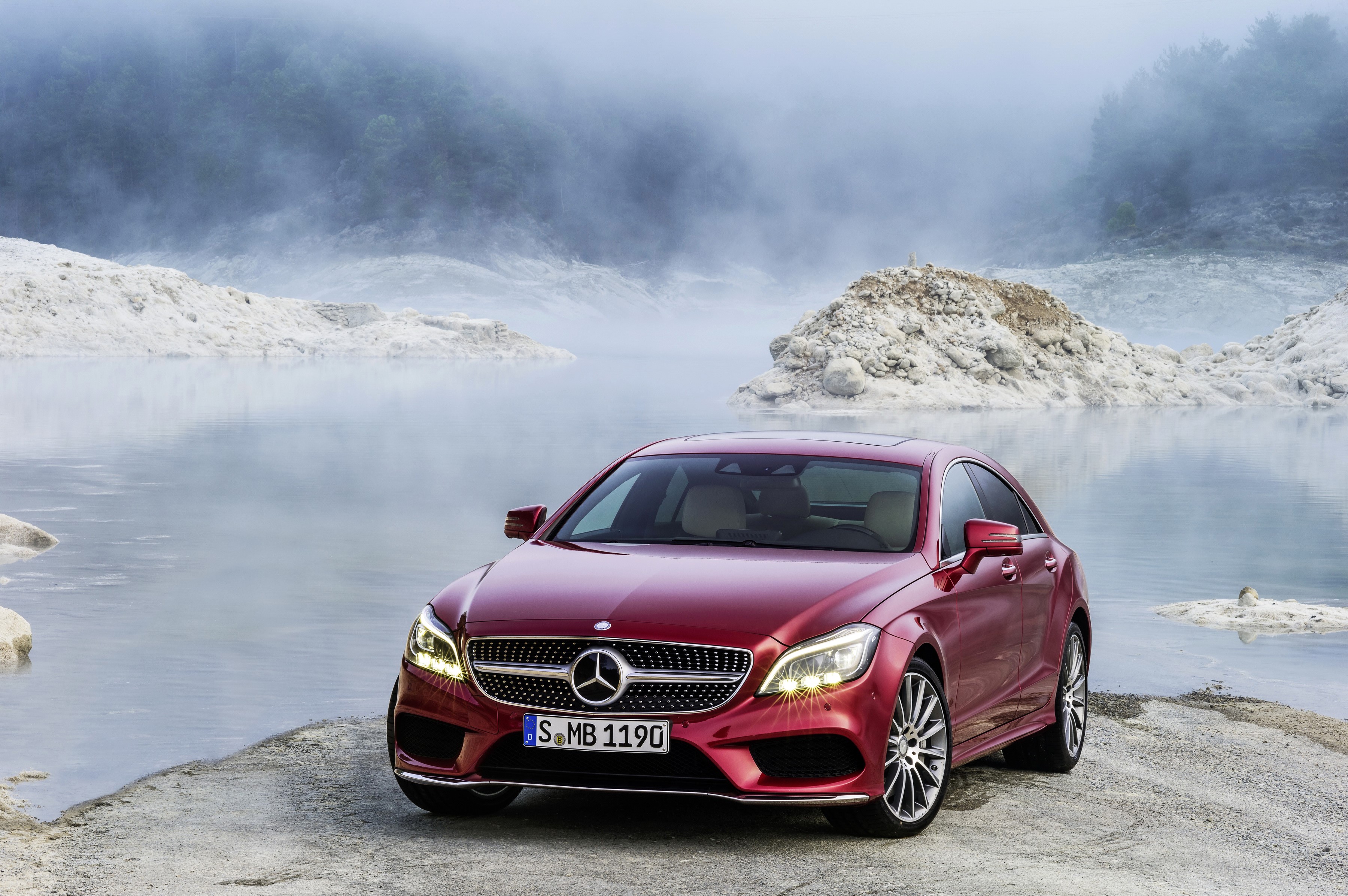 Red Mercedes-Benz CLS 500 4Matic parked by a lake HD Wallpaper