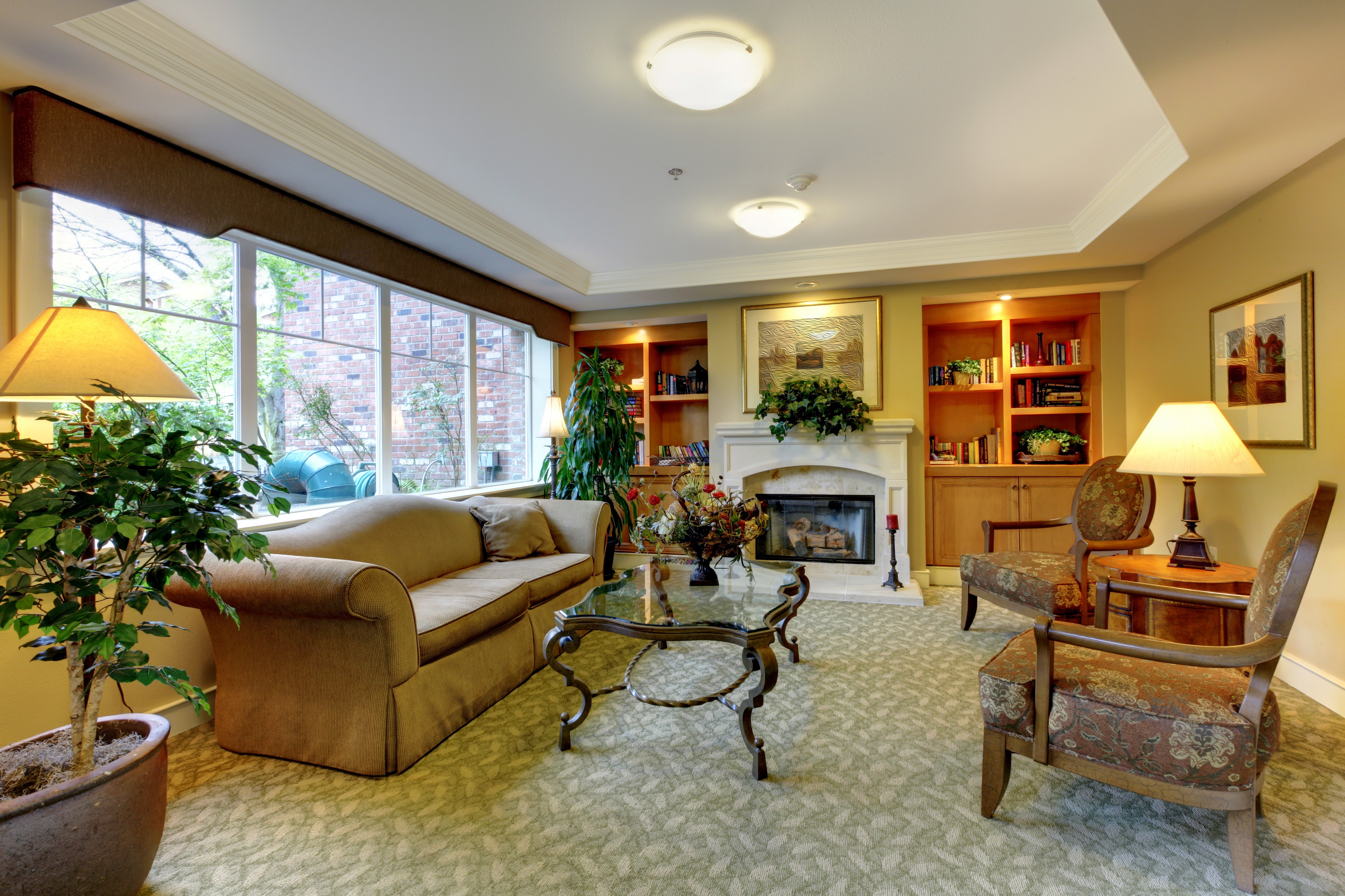 Living room with sofa, armchairs, and fireplace HD Wallpaper