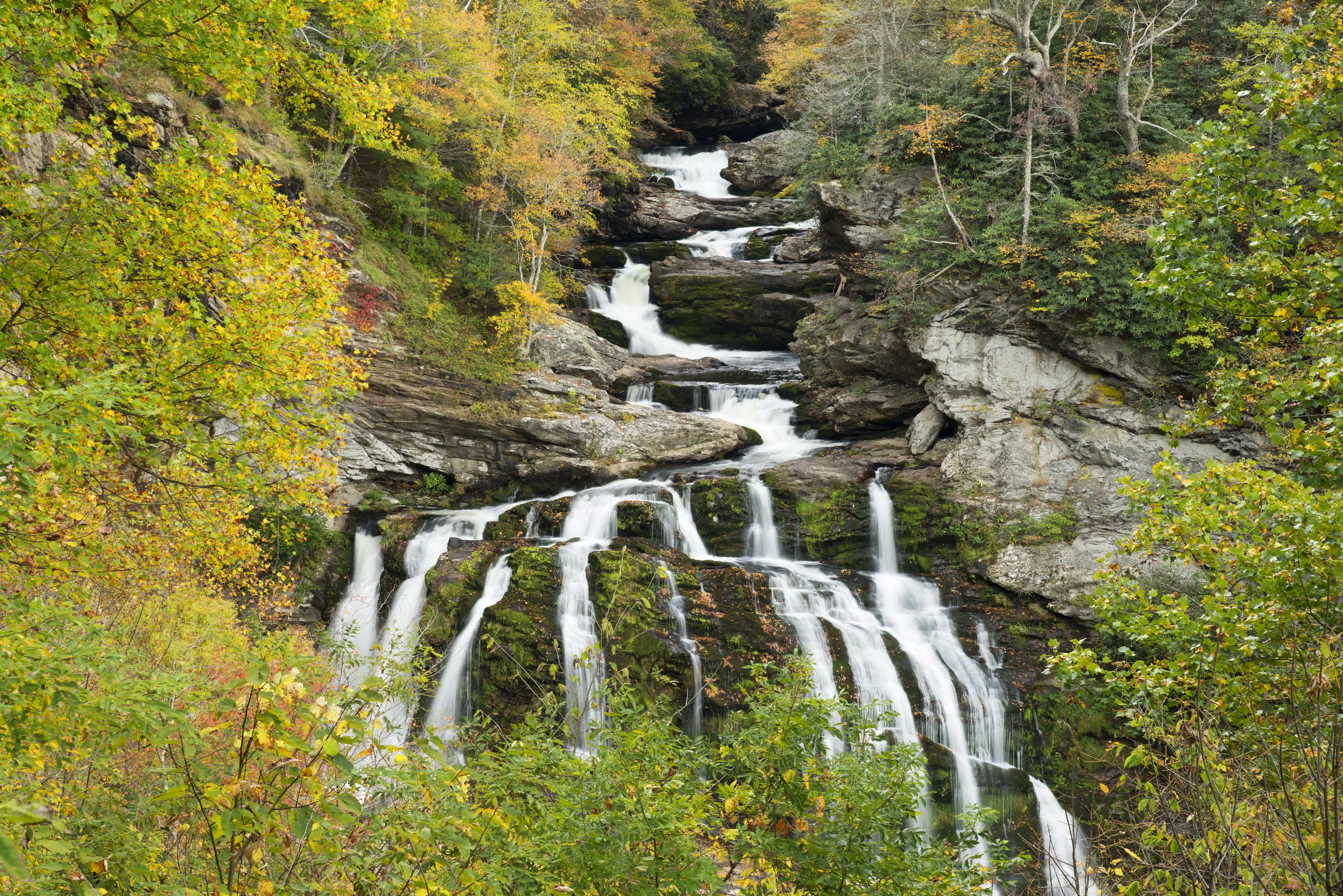 Waterfalls in a rocky gorge with autumn foliage HD Wallpaper