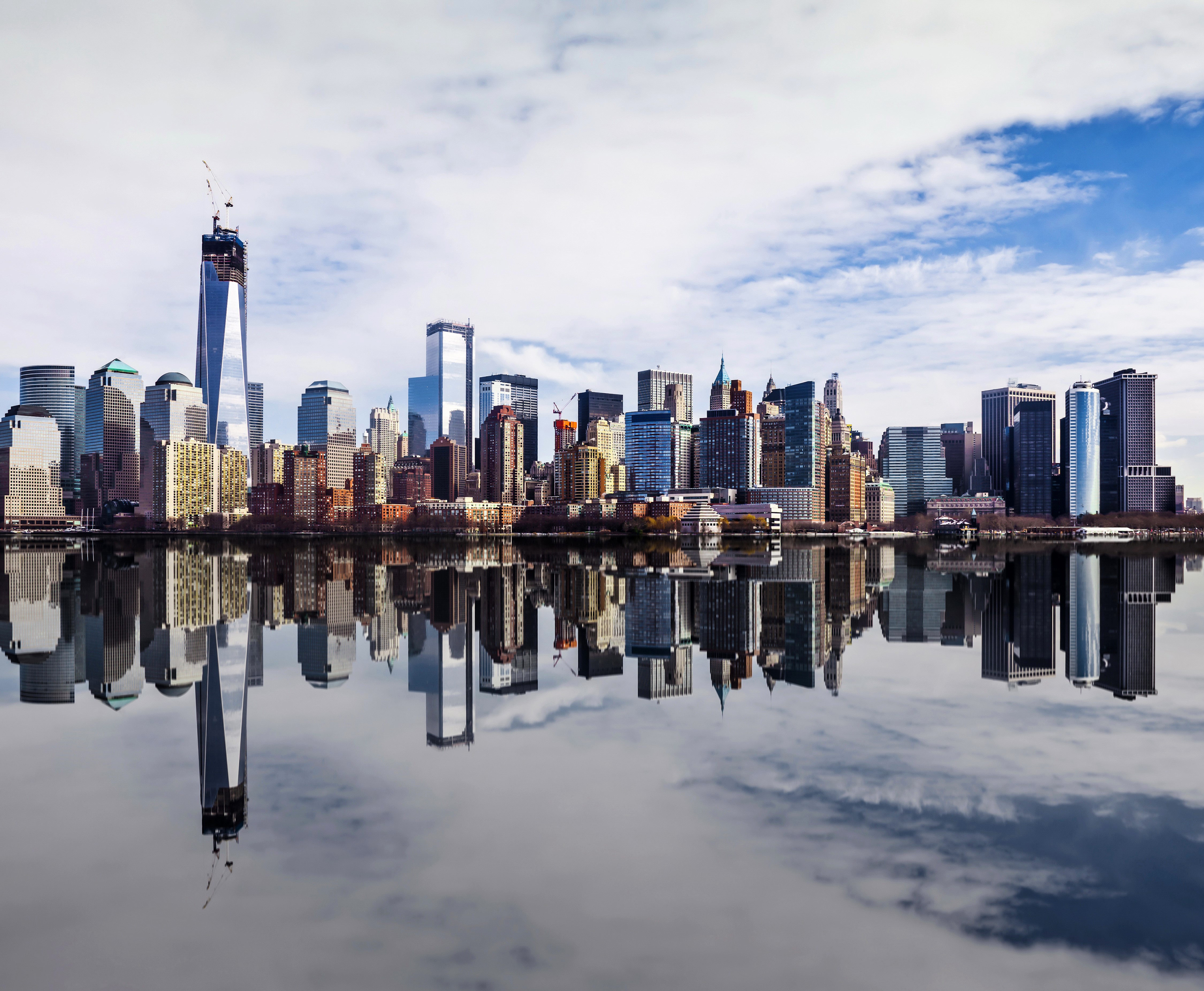 New York City skyline reflected in the water HD Wallpaper