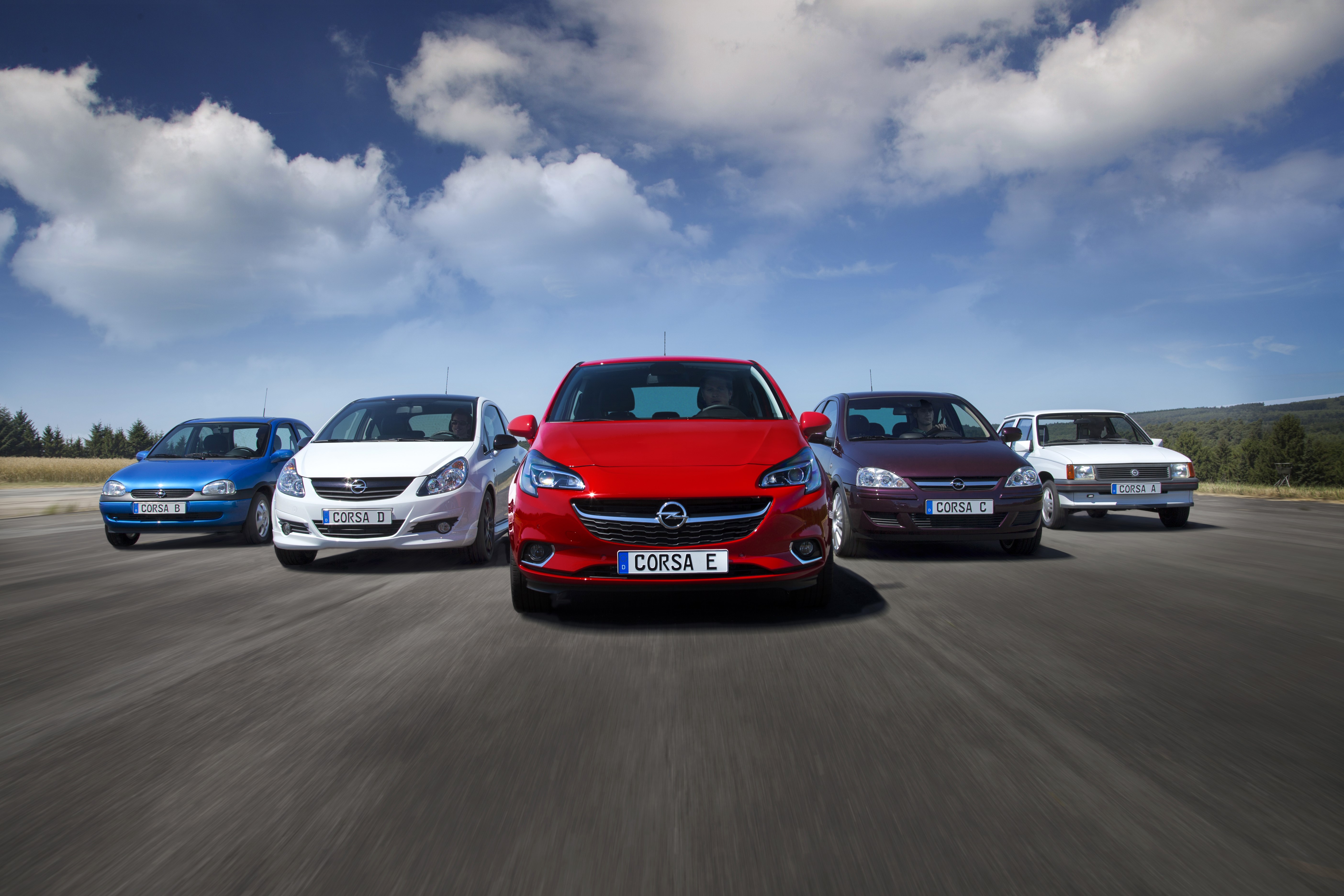 Opel Corsa generations on a road HD Wallpaper