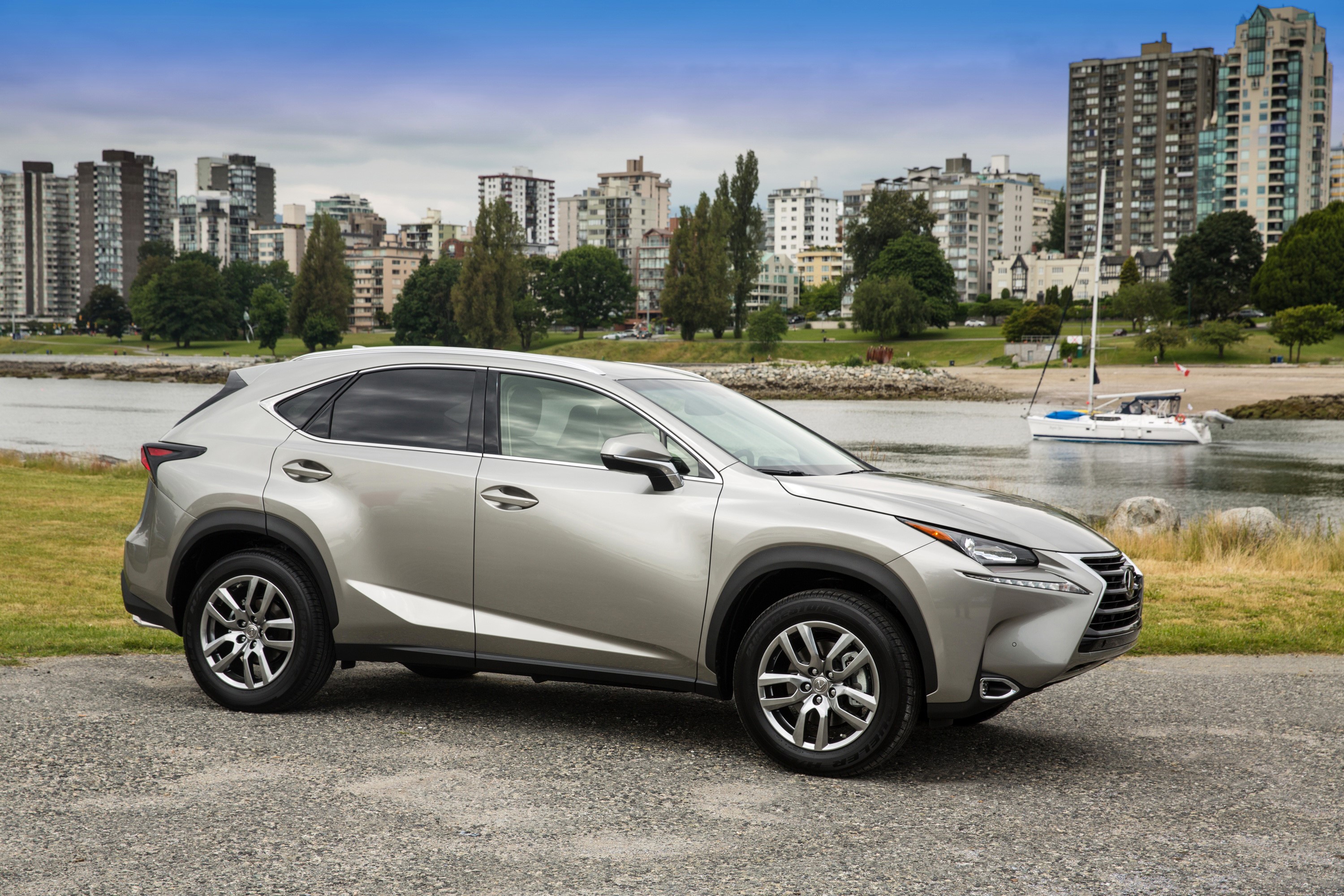 Silver 2015 Lexus NX 200t parked by a bay HD Wallpaper
