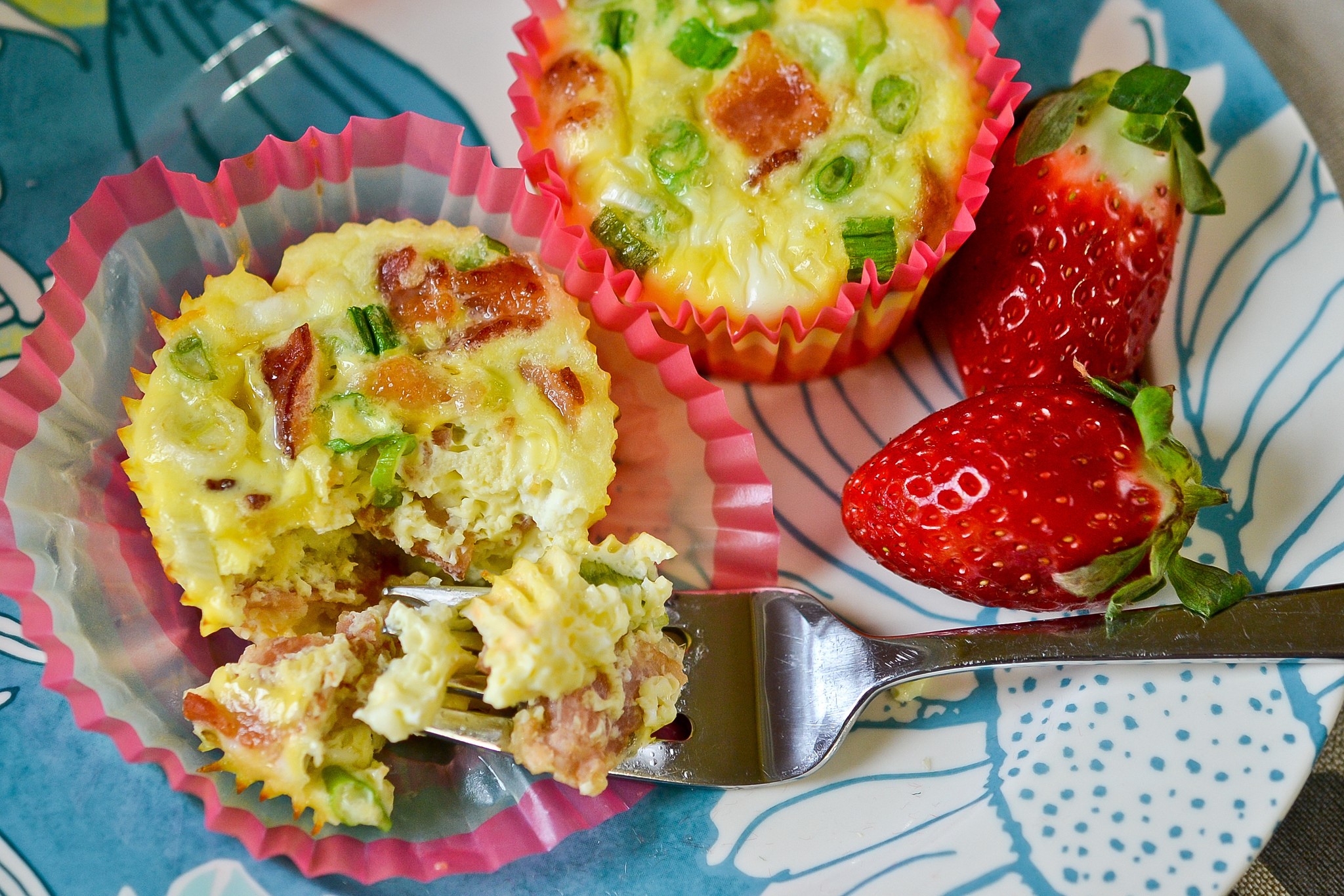 Egg bites with bacon and strawberries on a plate HD Wallpaper