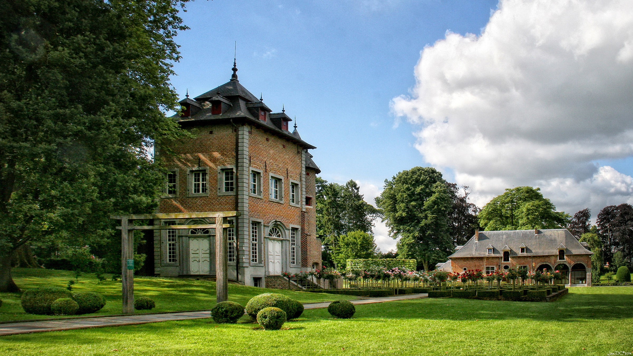 Coloma Rose Park in Belgium with historic buildings HD Wallpaper