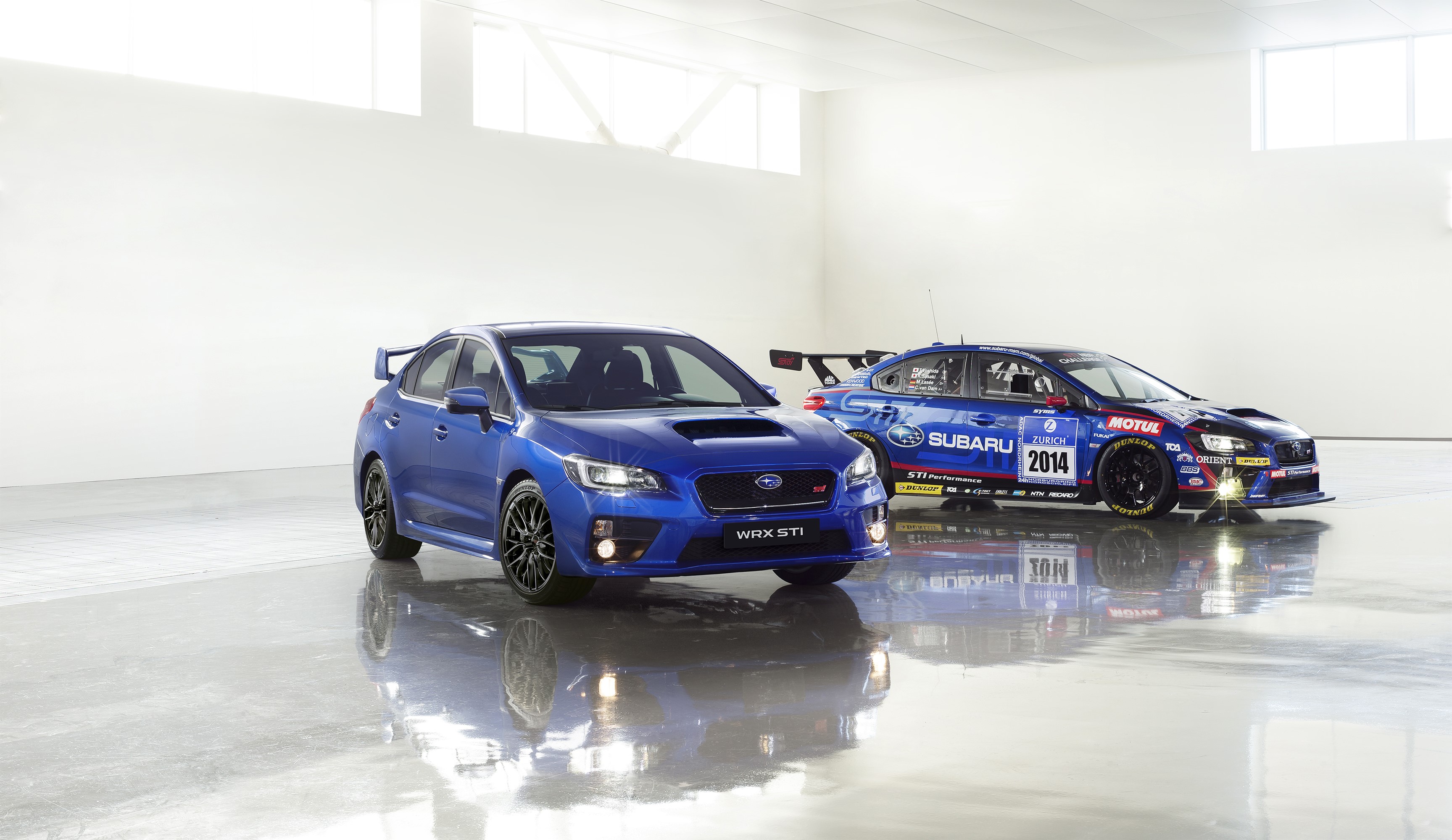 Two blue Subaru WRX STI cars HD Wallpaper
