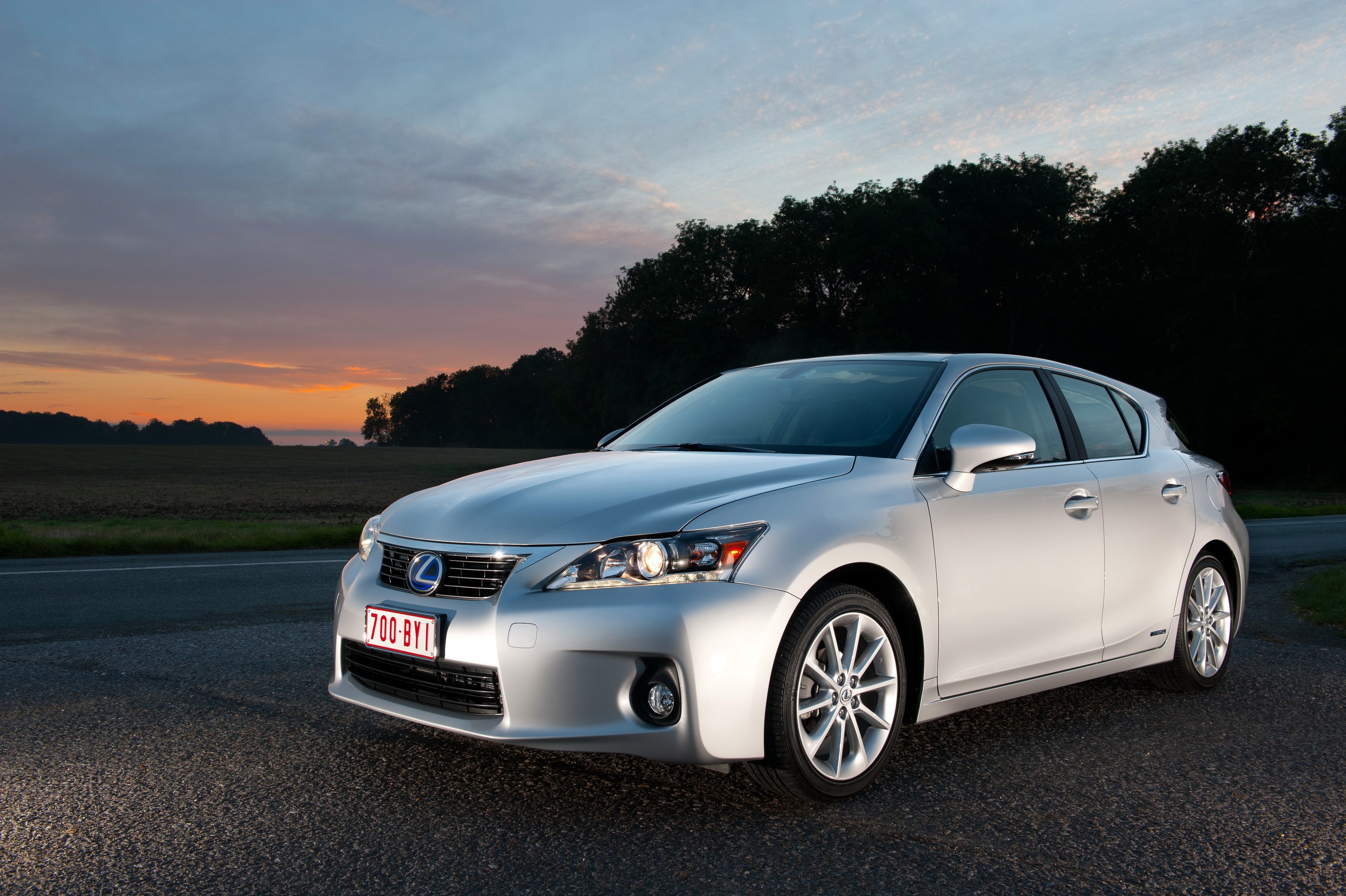 Silver 2011 Lexus CT 200h at sunset HD Wallpaper