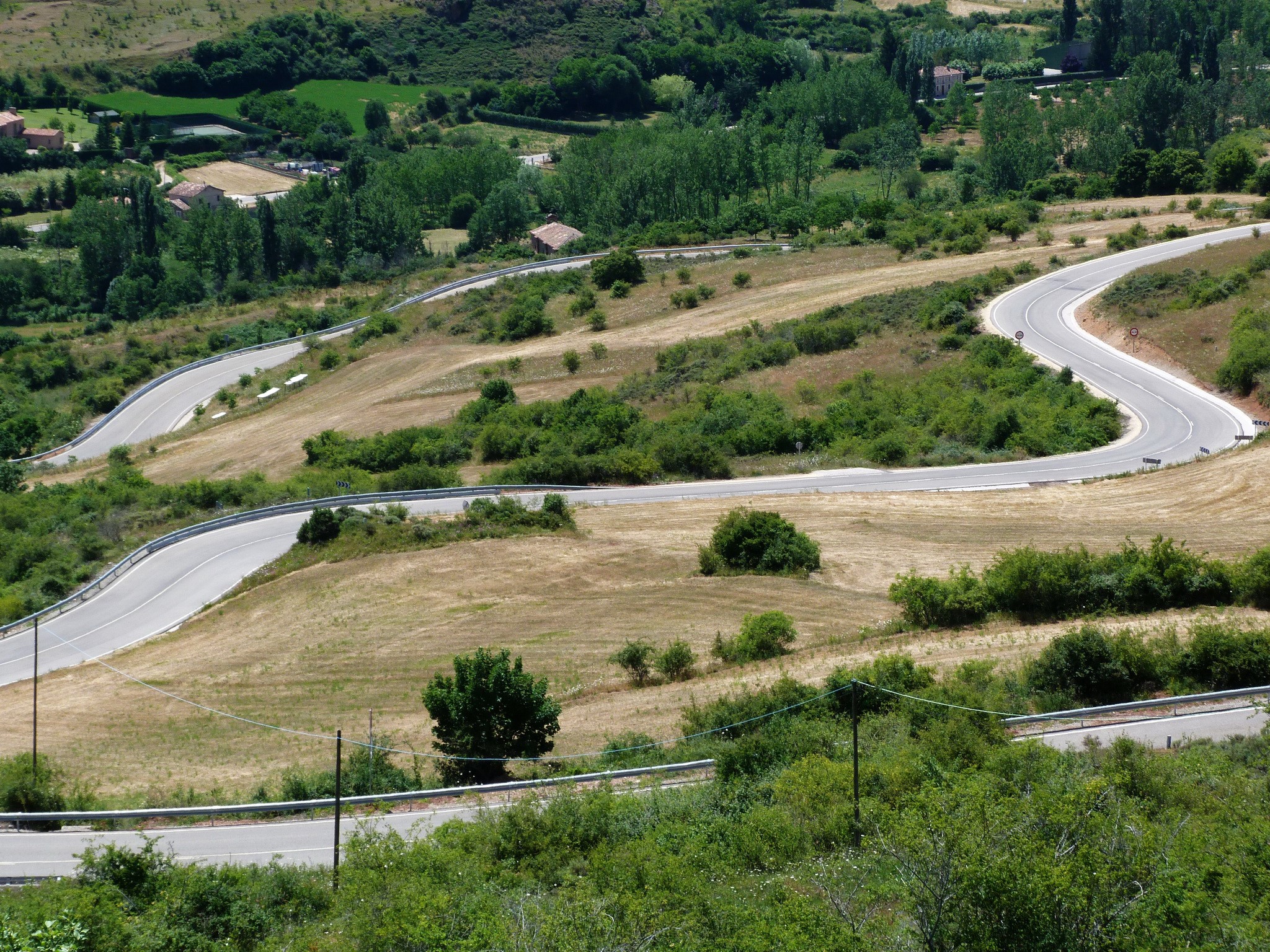 Winding road through the countryside near Burgos, Spain HD Wallpaper