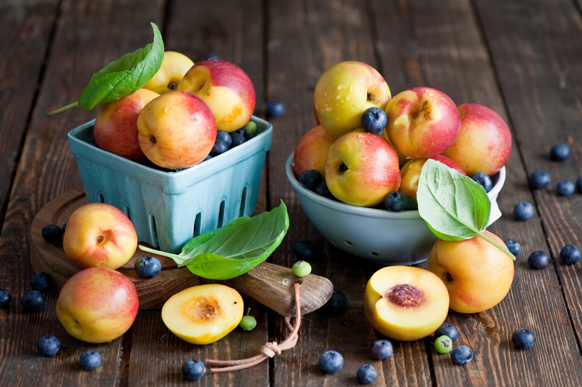 Peaches and blueberries in bowls on a wooden table HD Wallpaper