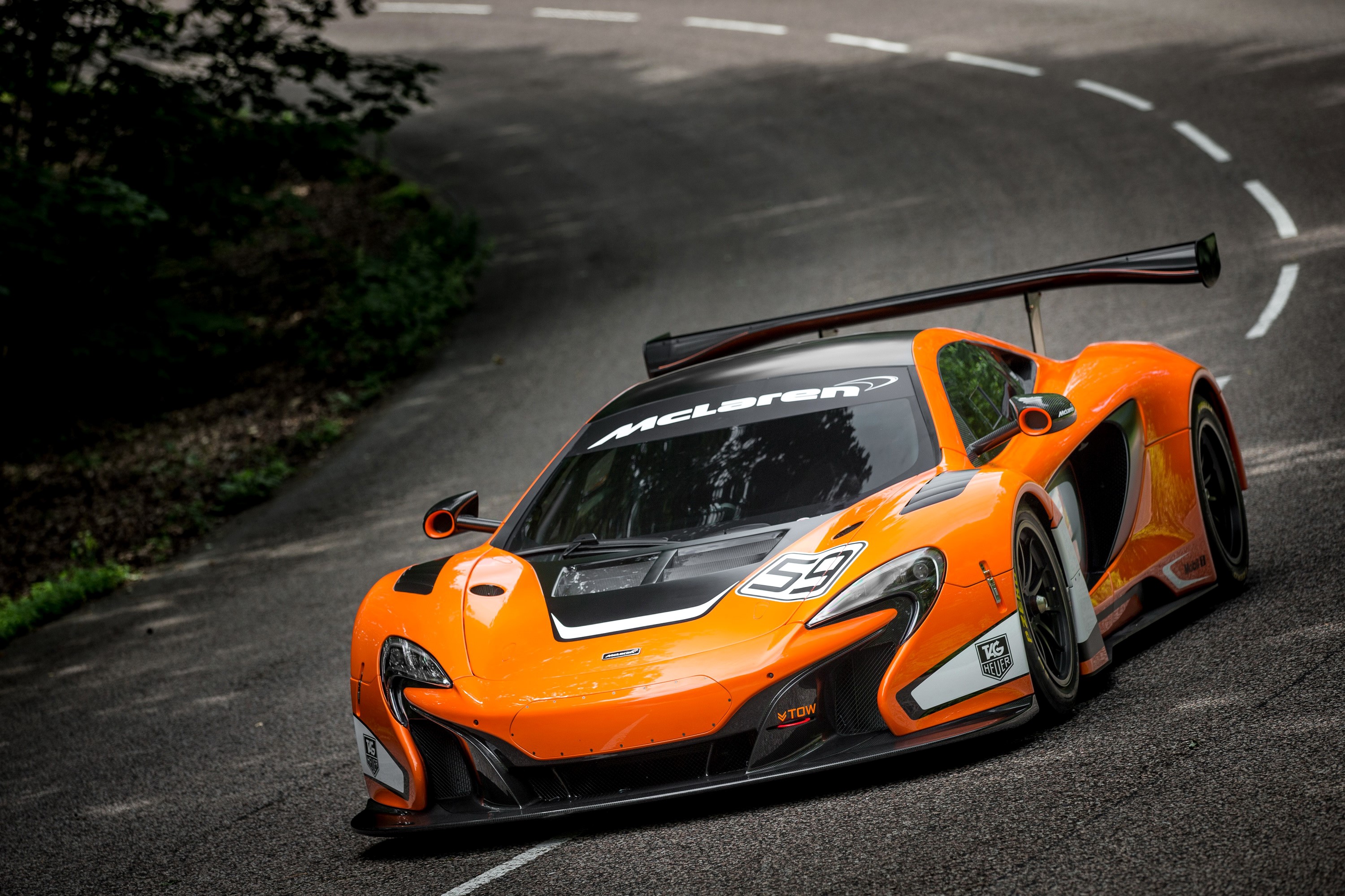McLaren 650S GT3 race car on a track HD Wallpaper