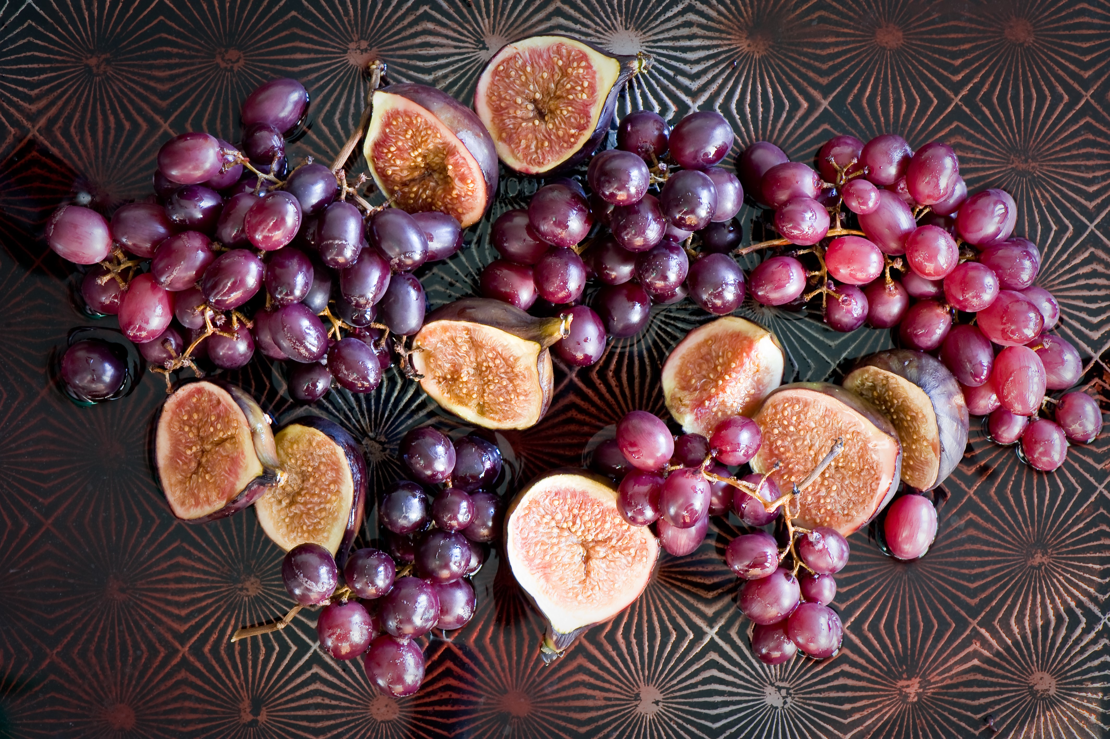 Grapes and figs on a patterned surface HD Wallpaper