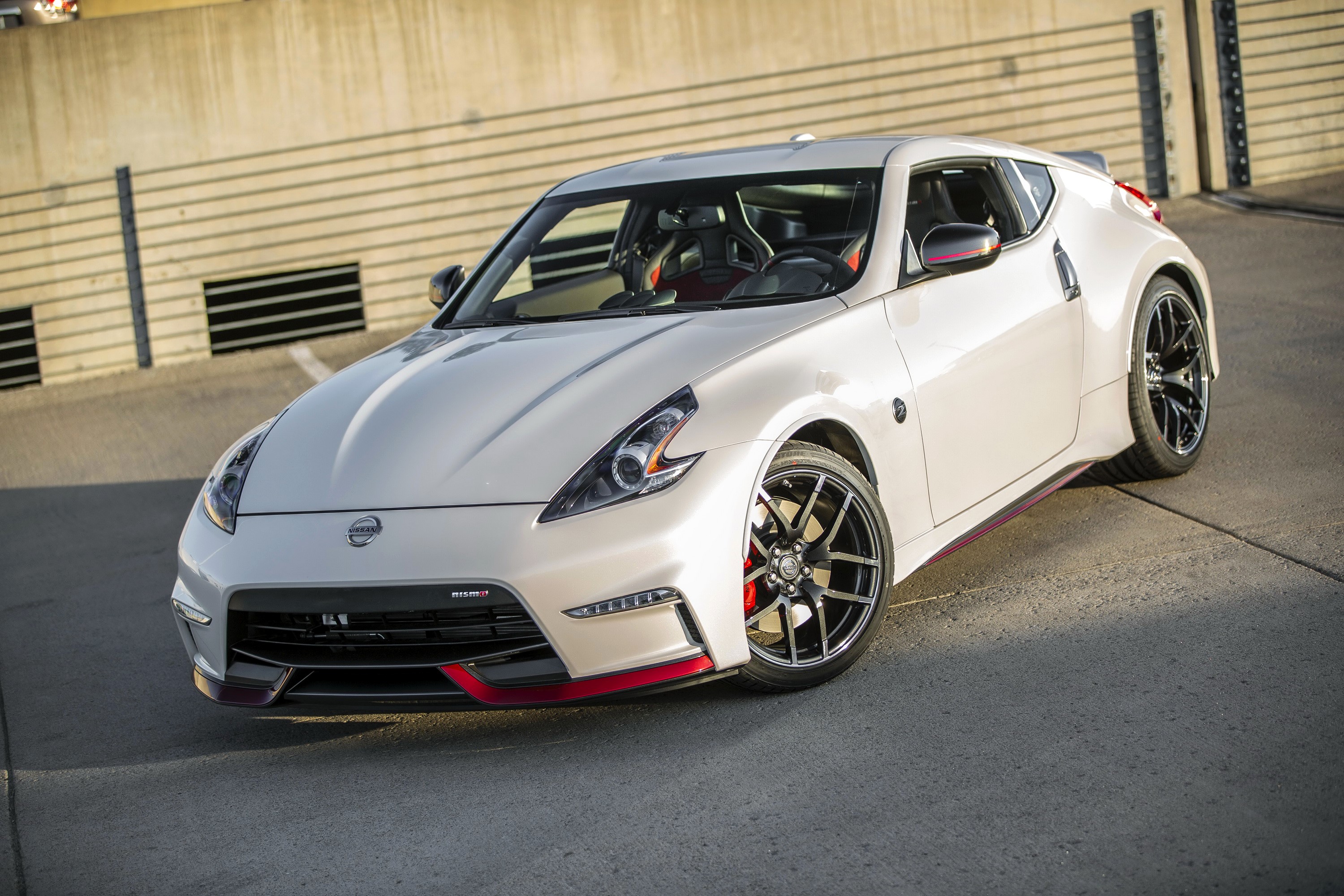 White 2015 Nissan 370Z Nismo parked outdoors HD Wallpaper