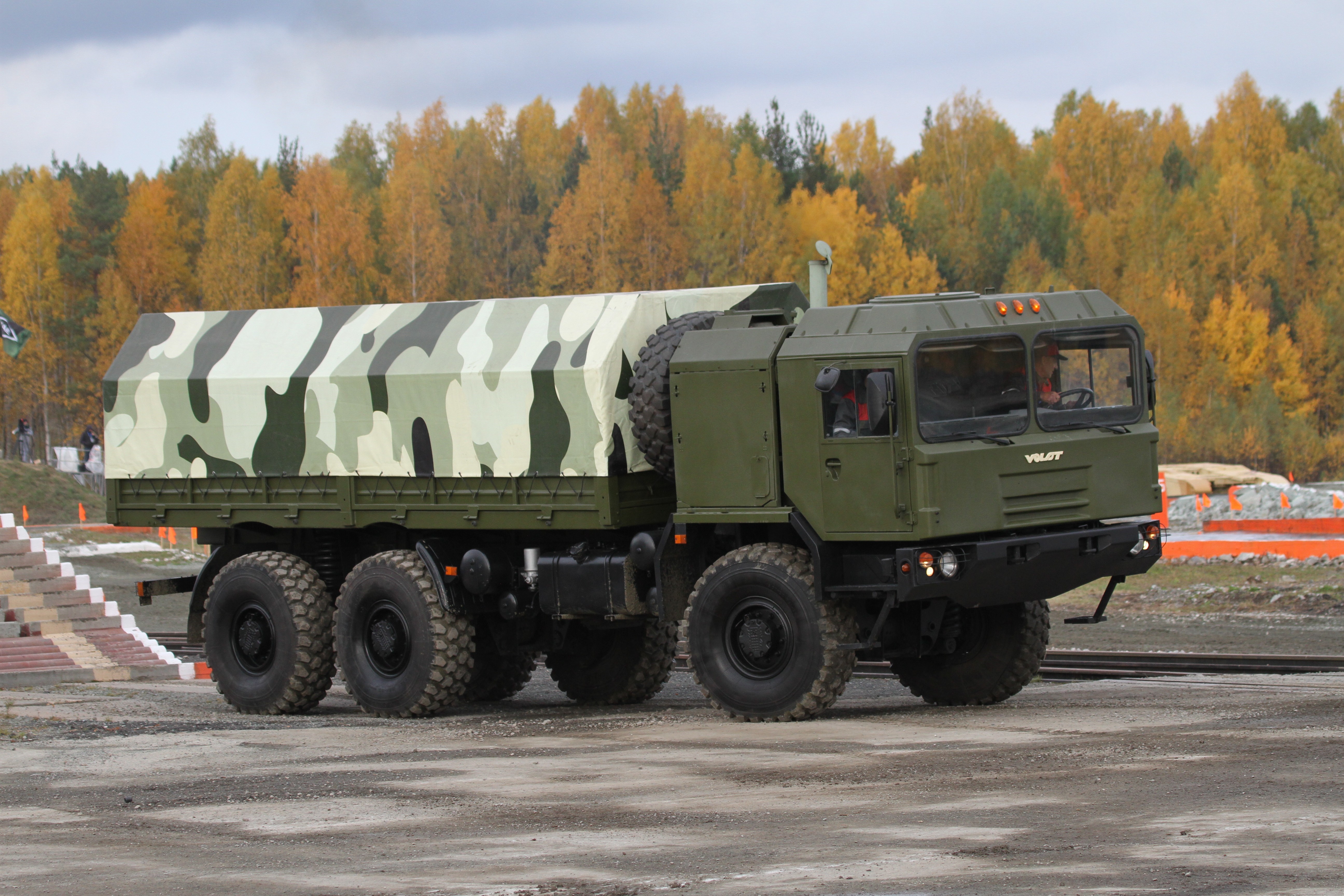 MZKT-6001 military truck with camouflage cover HD Wallpaper