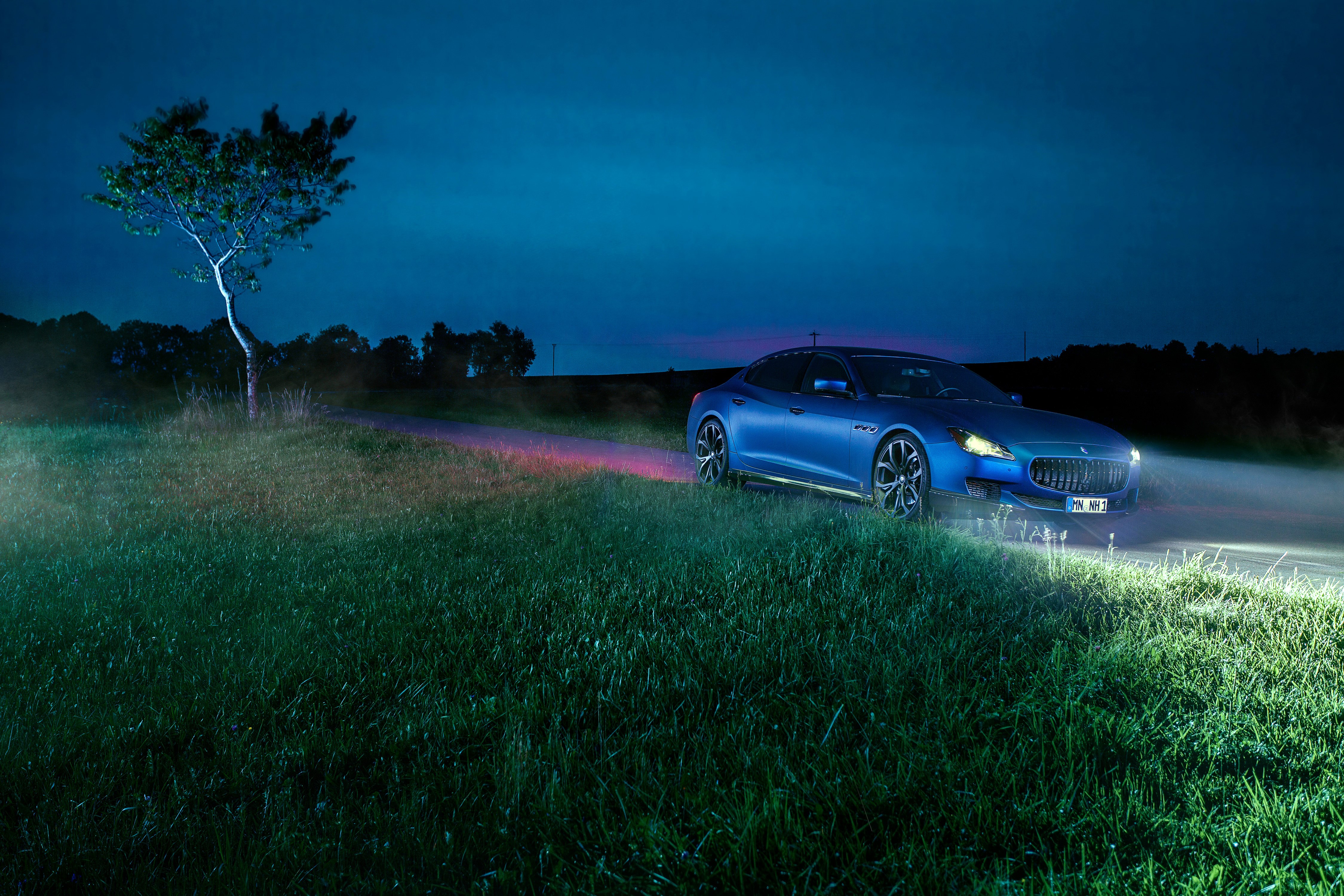 Blue Maserati Quattroporte at Night on a Grassy Road HD Wallpaper