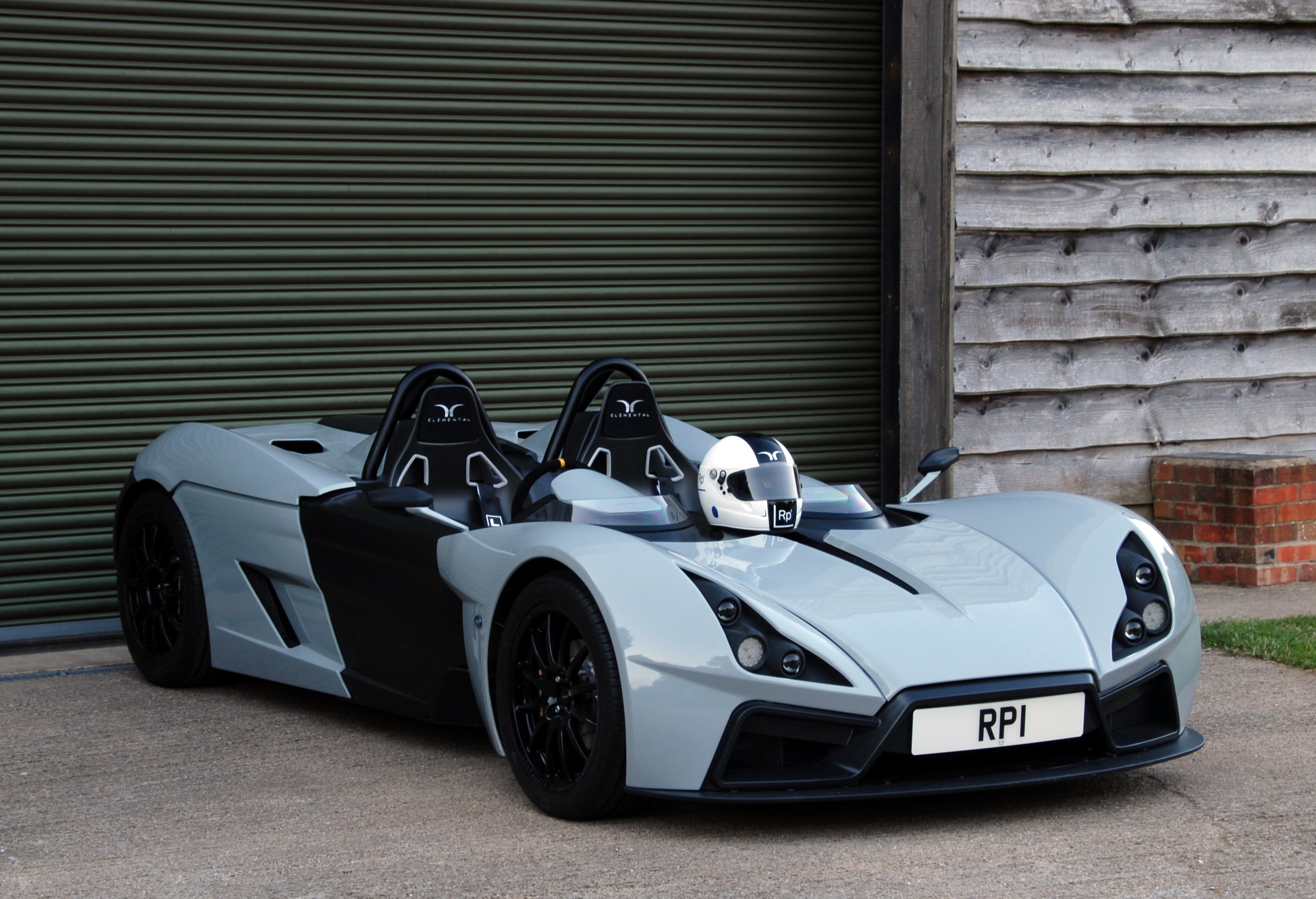 2014 Elemental RP1 sports car with helmet HD Wallpaper