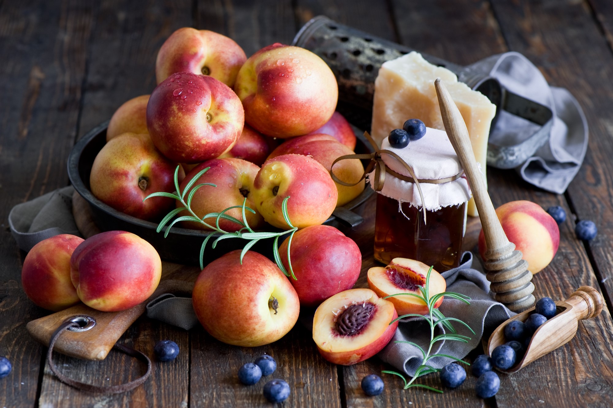 Peaches, Blueberries, Honey Jar, and Cheese on Wooden Table HD Wallpaper
