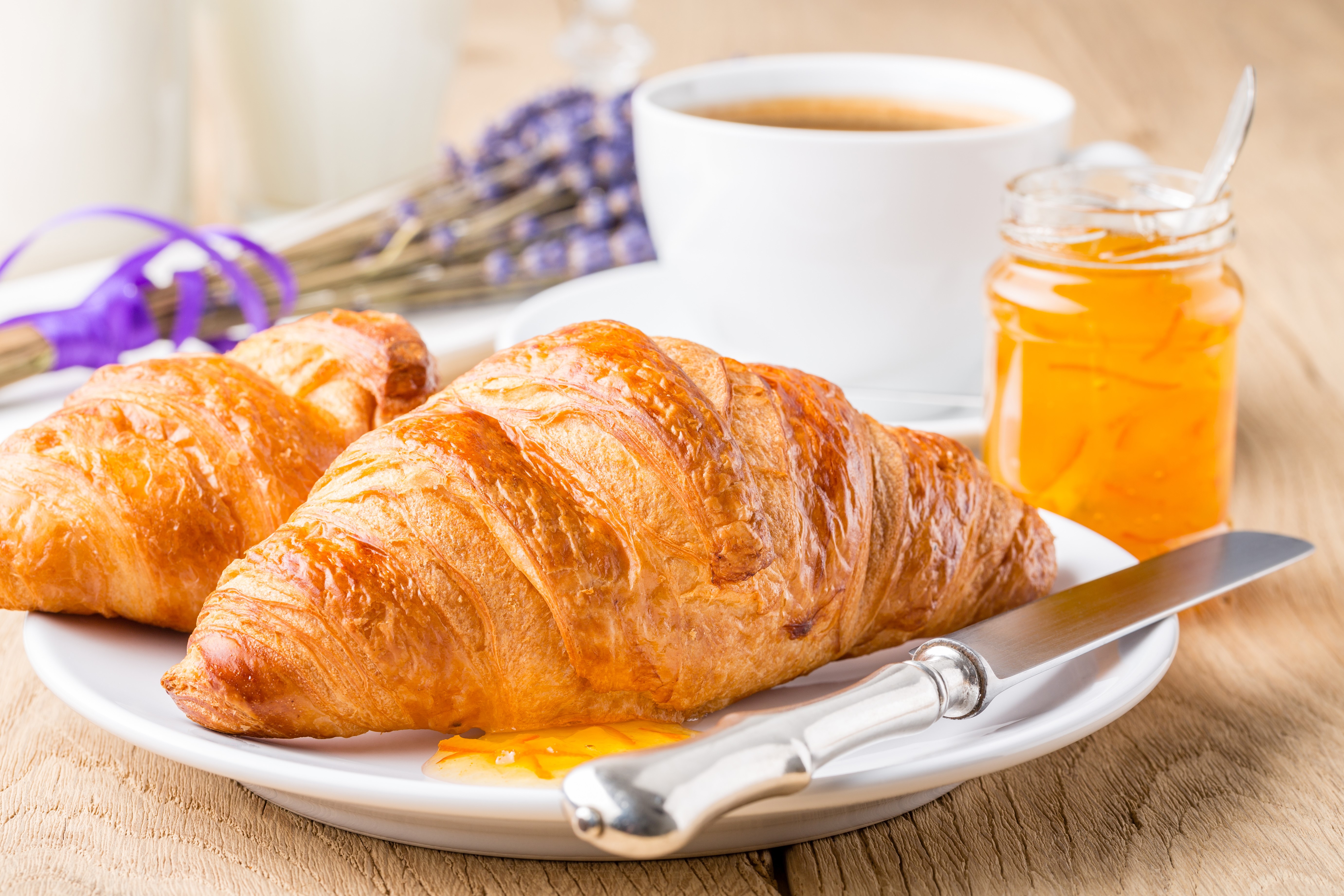 Croissants with jam and coffee on a wooden table HD Wallpaper