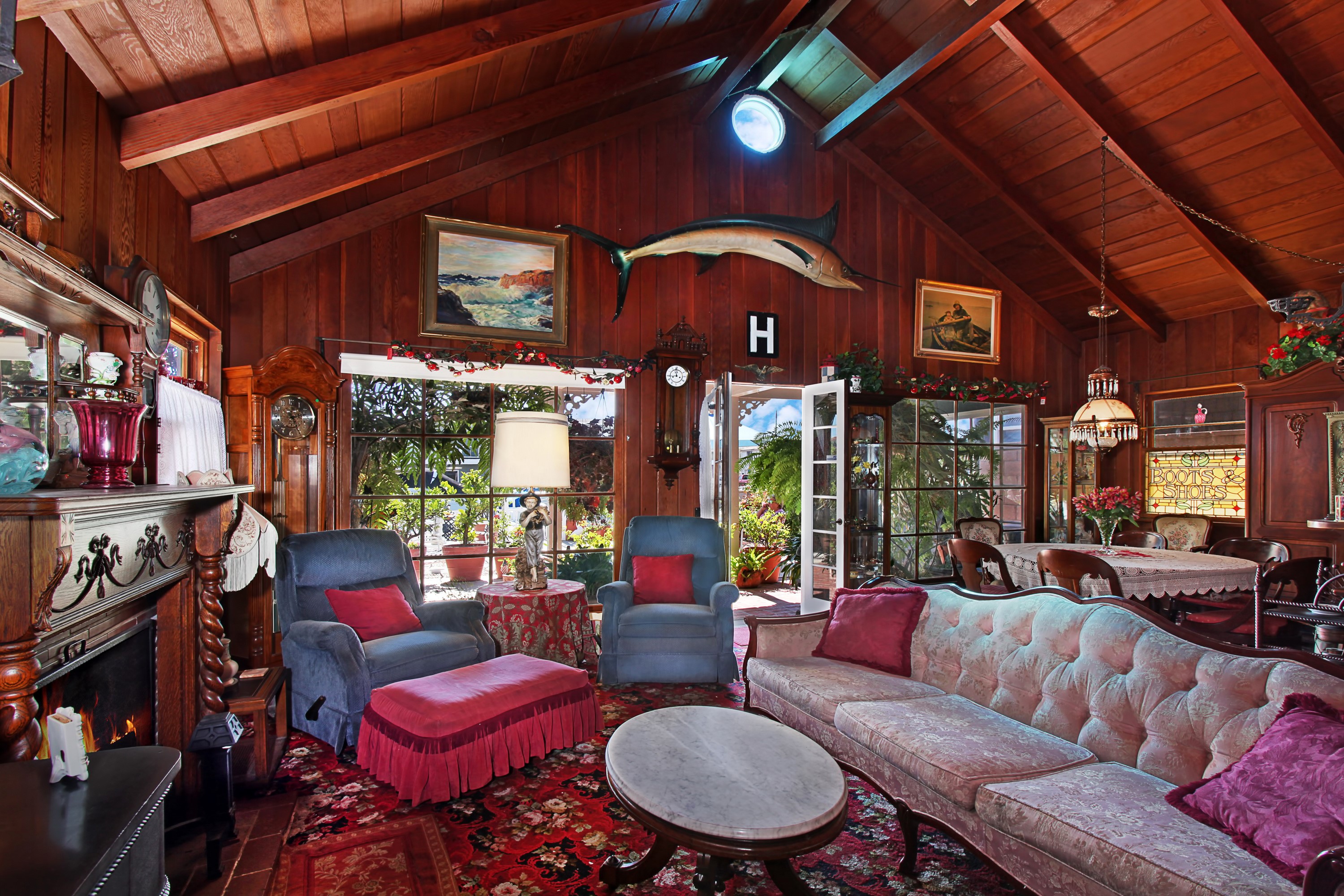 Living room with fireplace, sofa, and armchairs HD Wallpaper