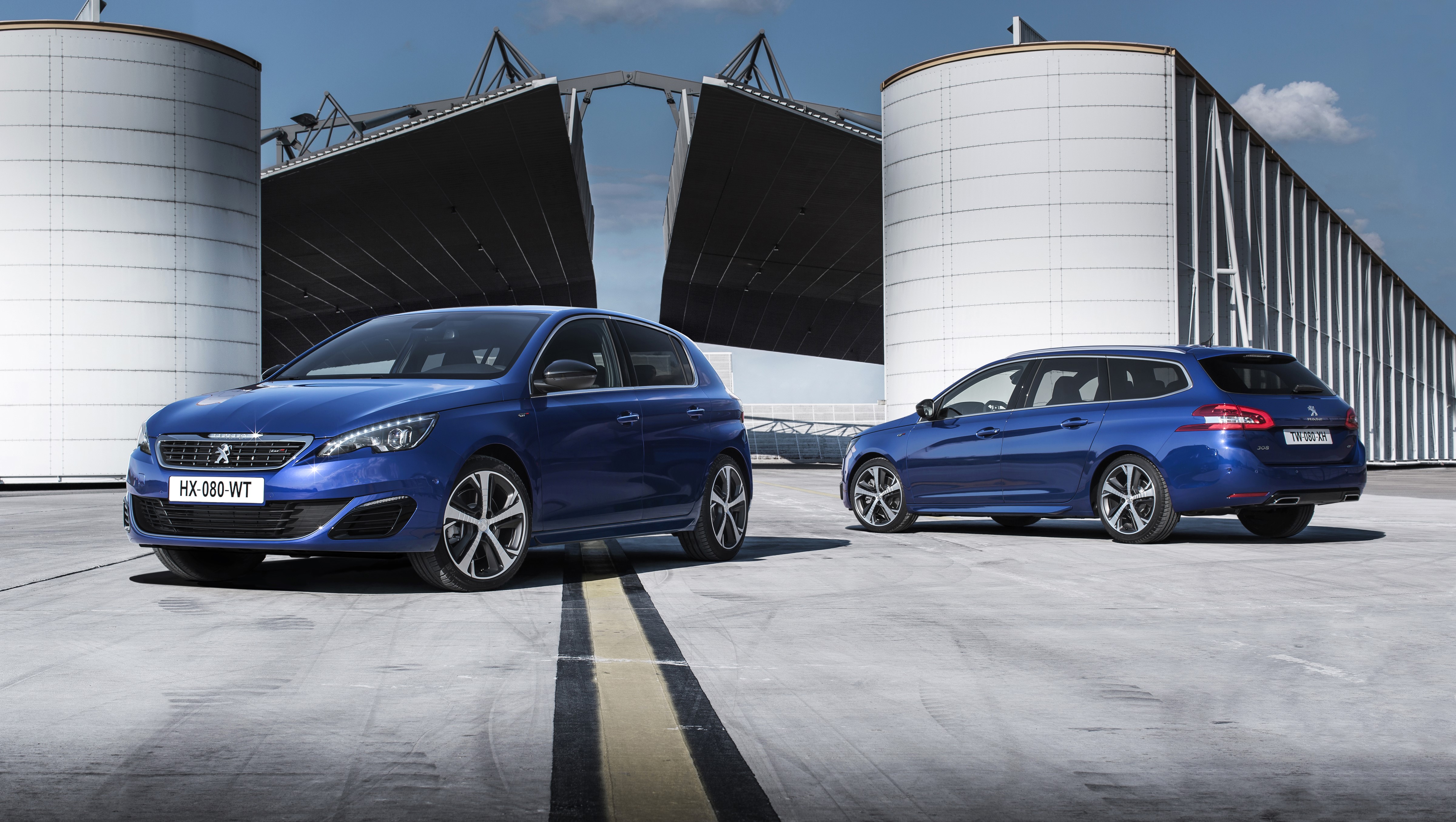 Two blue Peugeot 308 GT cars HD Wallpaper