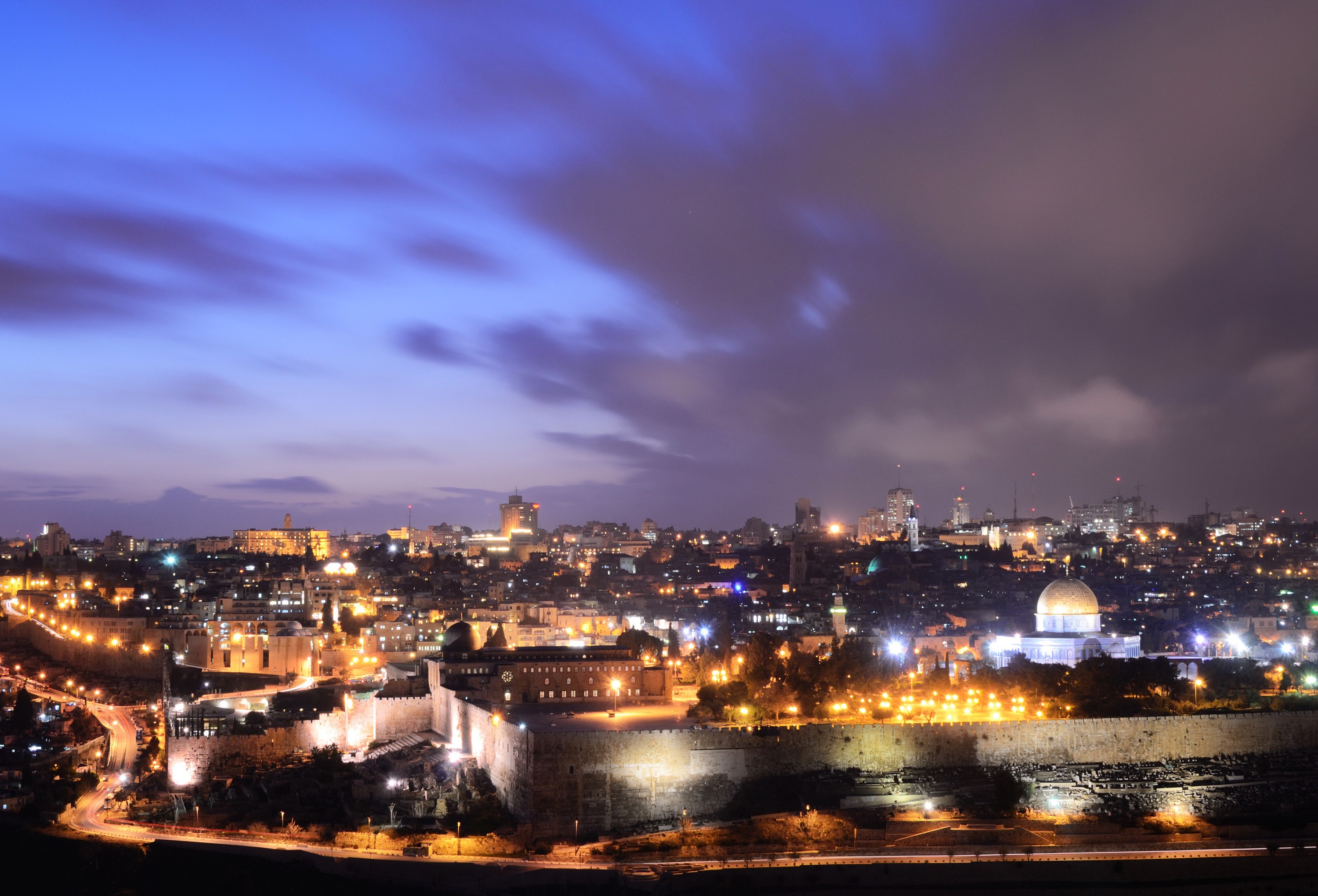 Night view of Jerusalem with illuminated walls and buildings HD Wallpaper