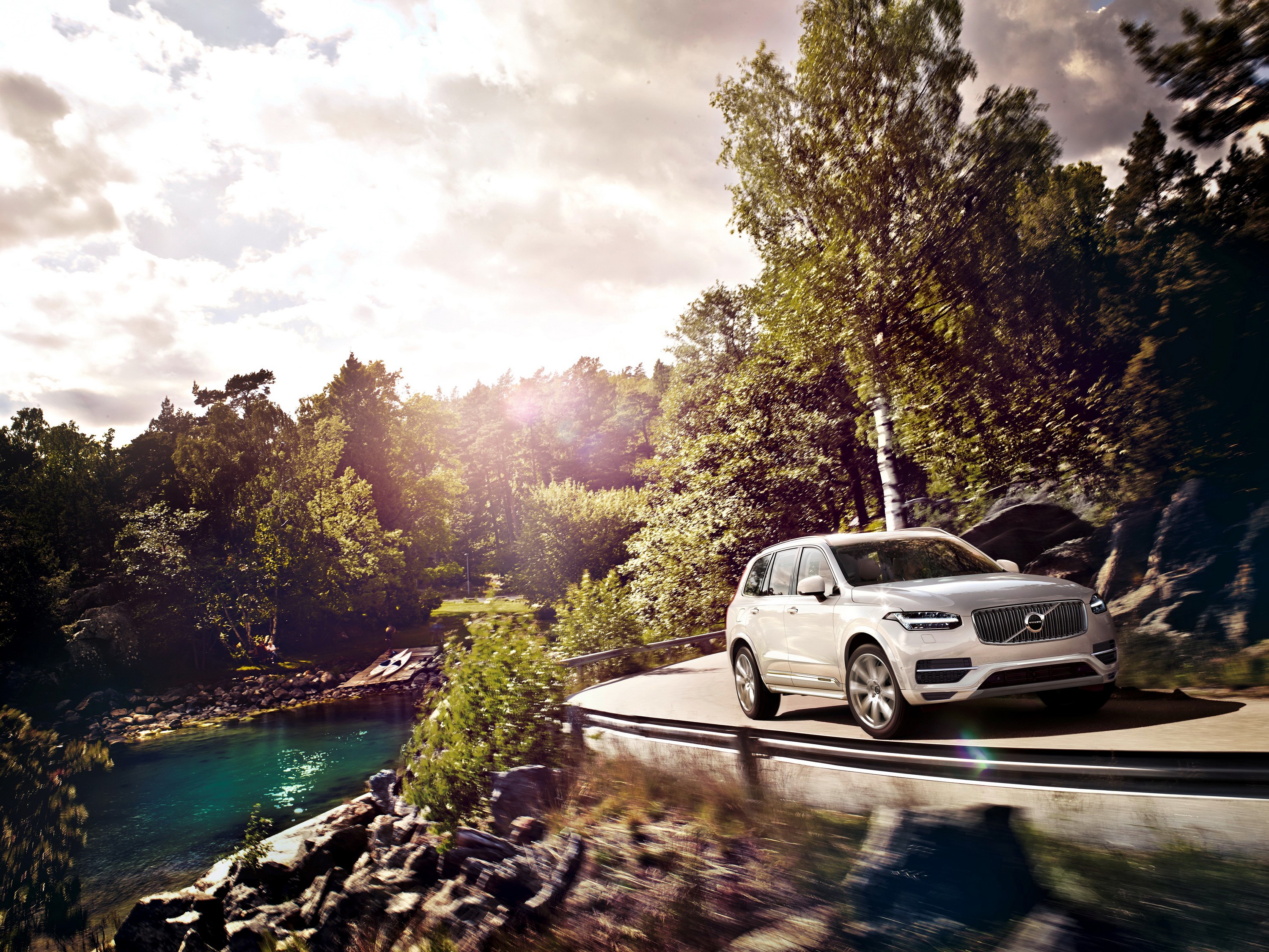White Volvo XC90 driving on a scenic road HD Wallpaper