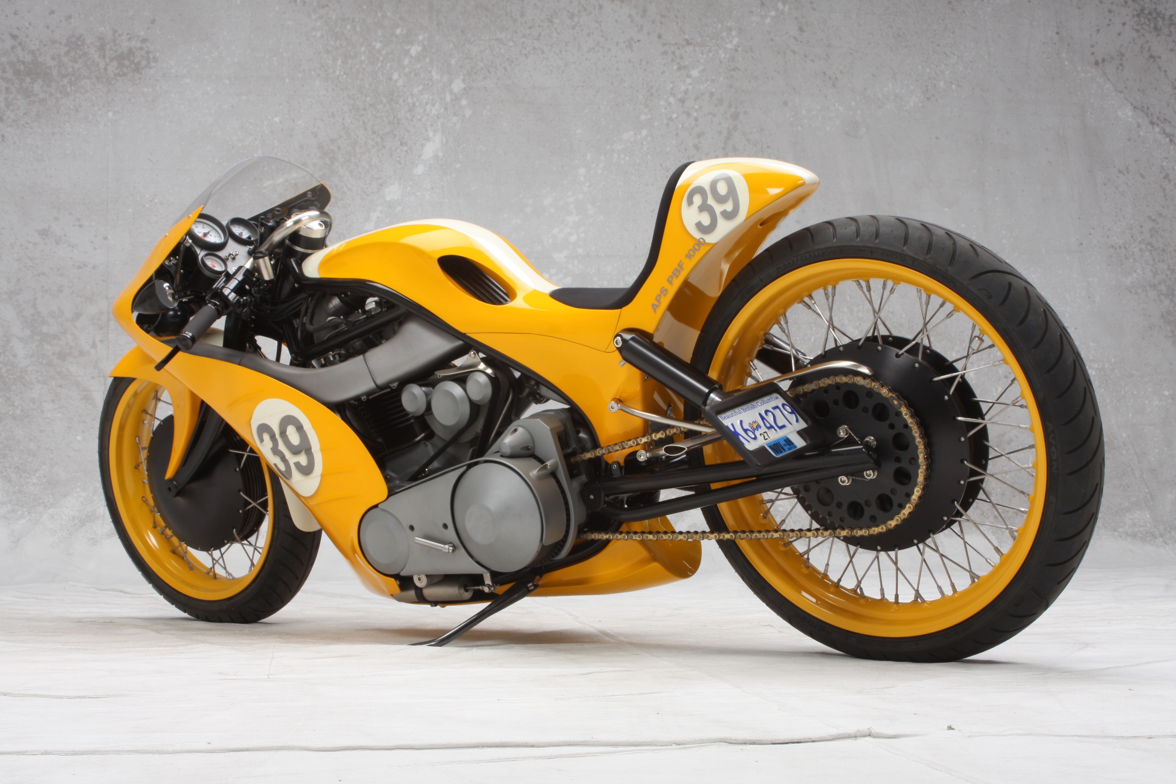 Yellow custom cafe racer motorcycle with number 39 HD Wallpaper