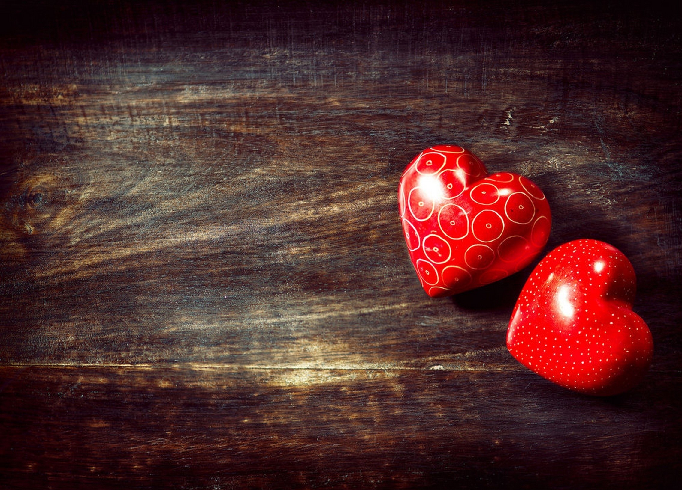Two red hearts on a wooden background HD Wallpaper