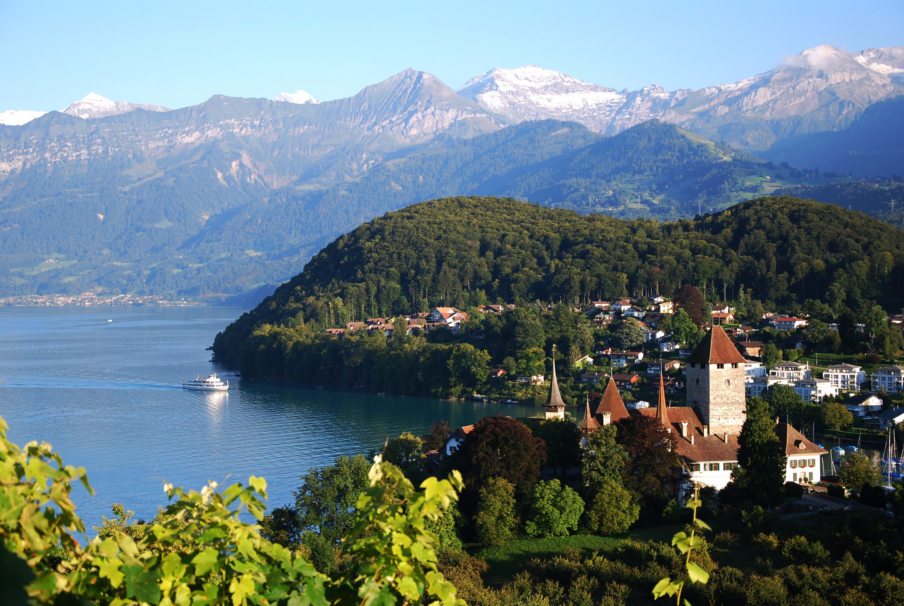 Spiez Castle on Lake Thun with Swiss Alps HD Wallpaper