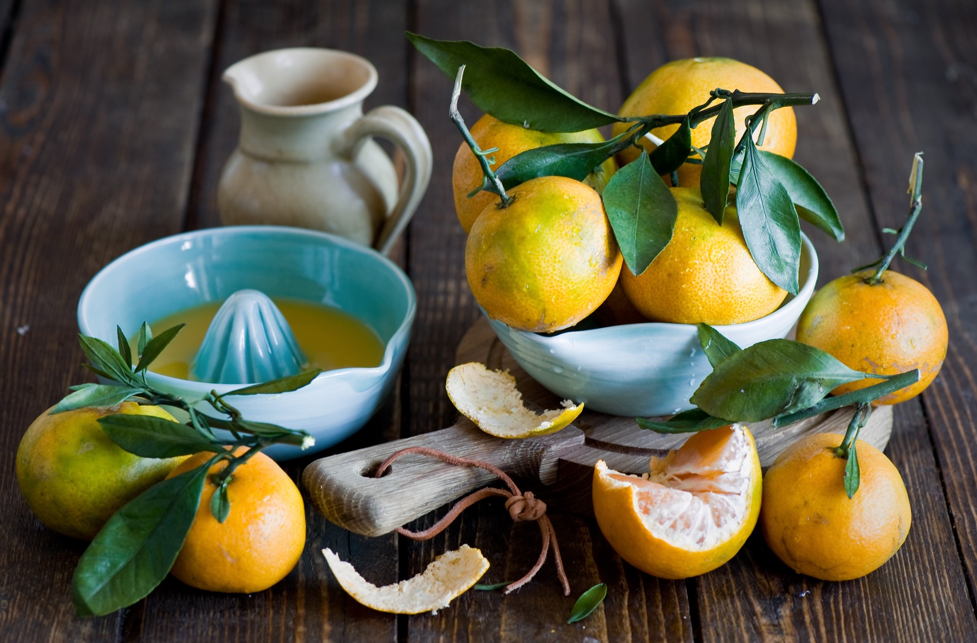 Oranges and citrus juicer on a wooden table HD Wallpaper