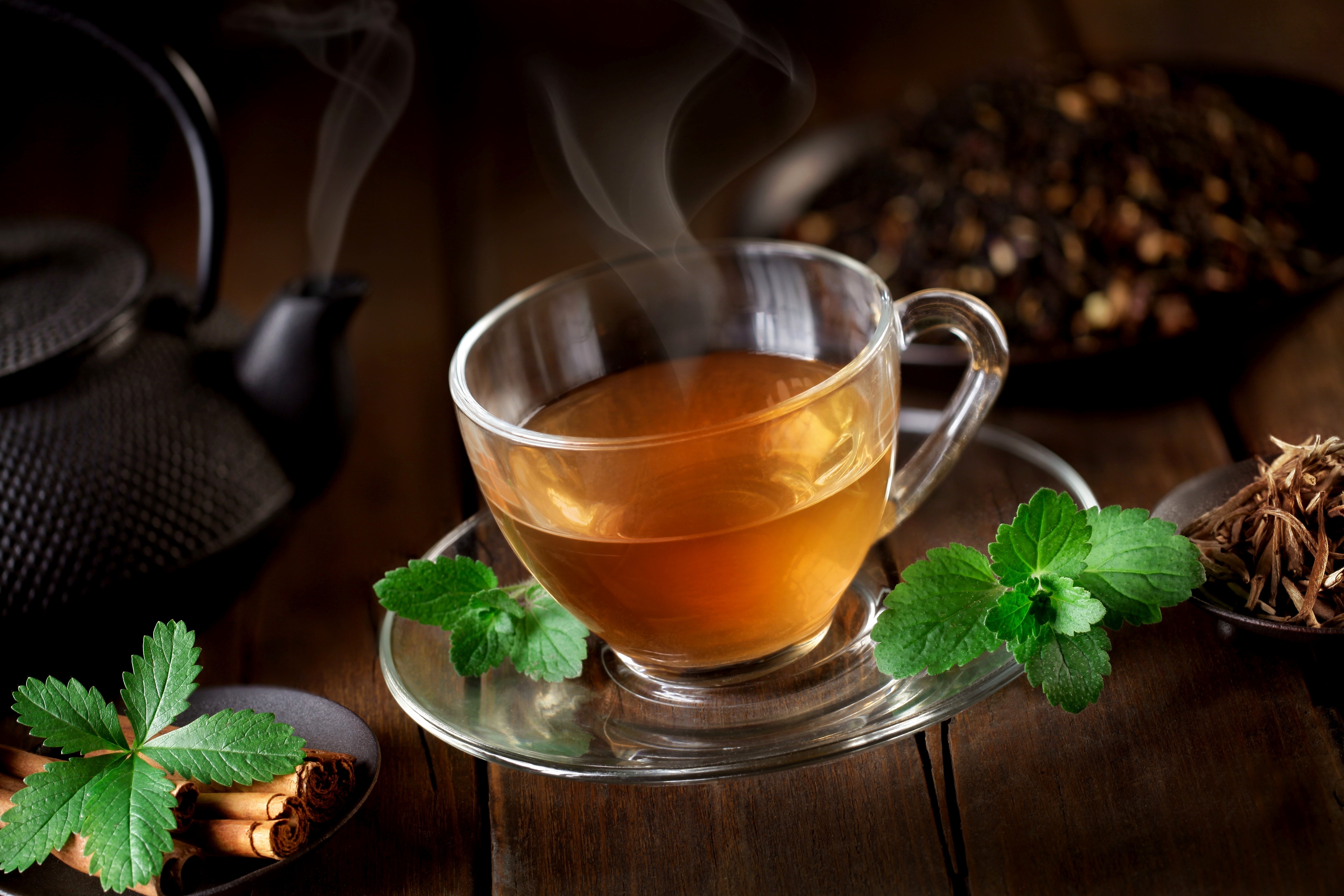 Hot Tea in a Cup with Steaming Vapor HD Wallpaper