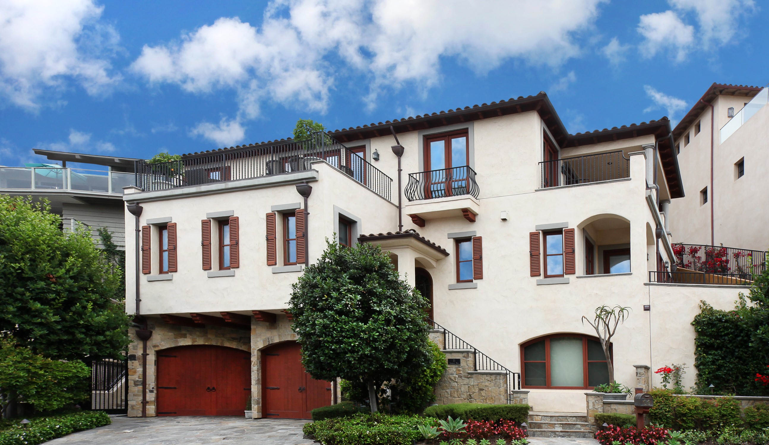 Luxury Mediterranean-style house with garage and landscaping HD Wallpaper