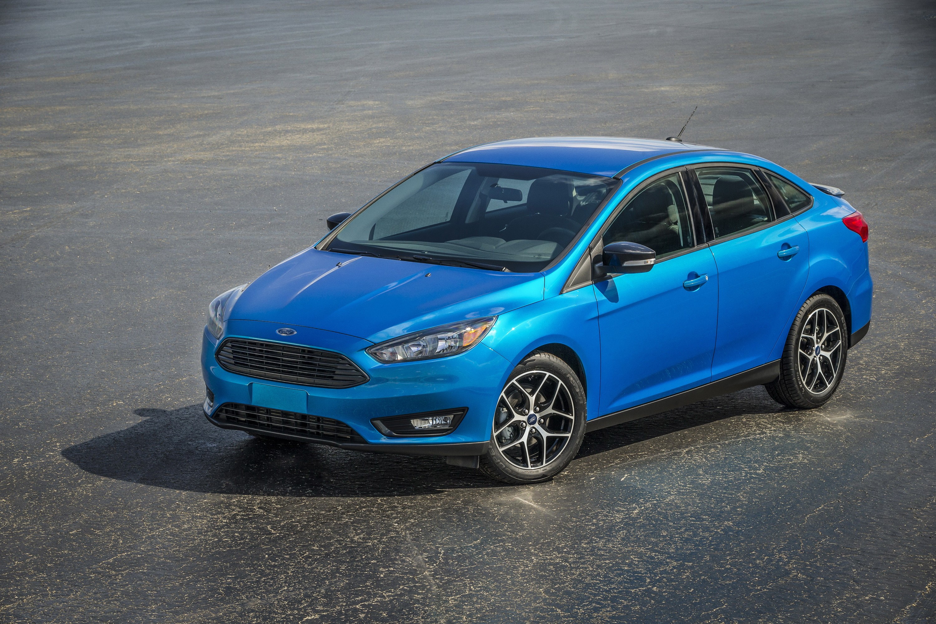 Blue Ford Focus Sedan parked on asphalt HD Wallpaper