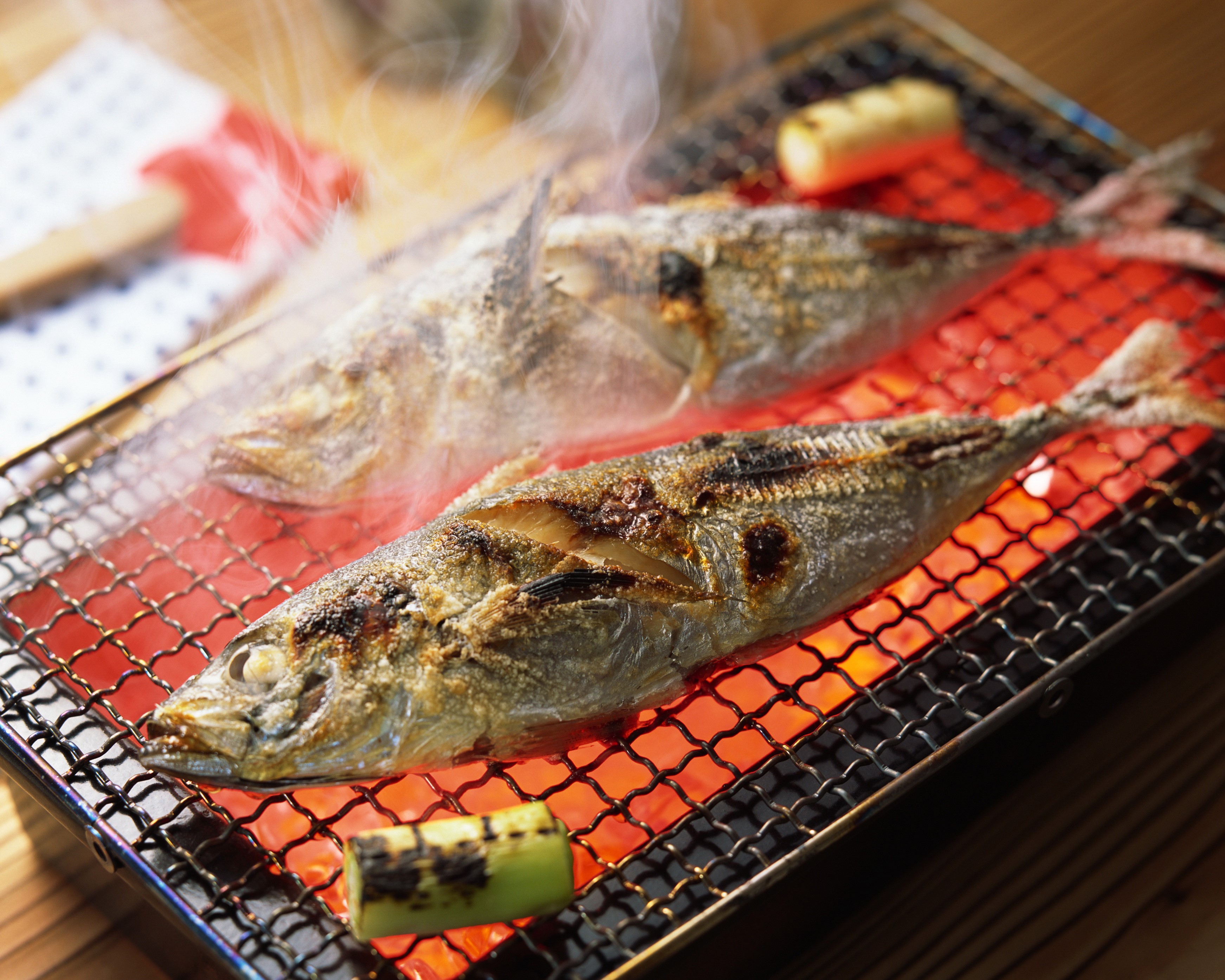 Two grilled fish on a barbecue grill HD Wallpaper