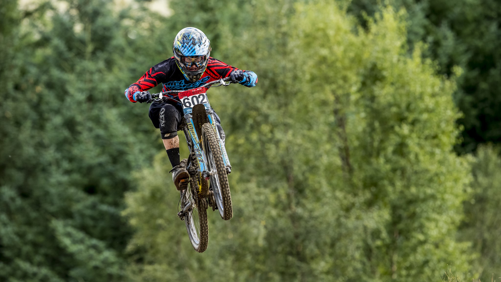 Mountain biker in mid-air jump HD Wallpaper