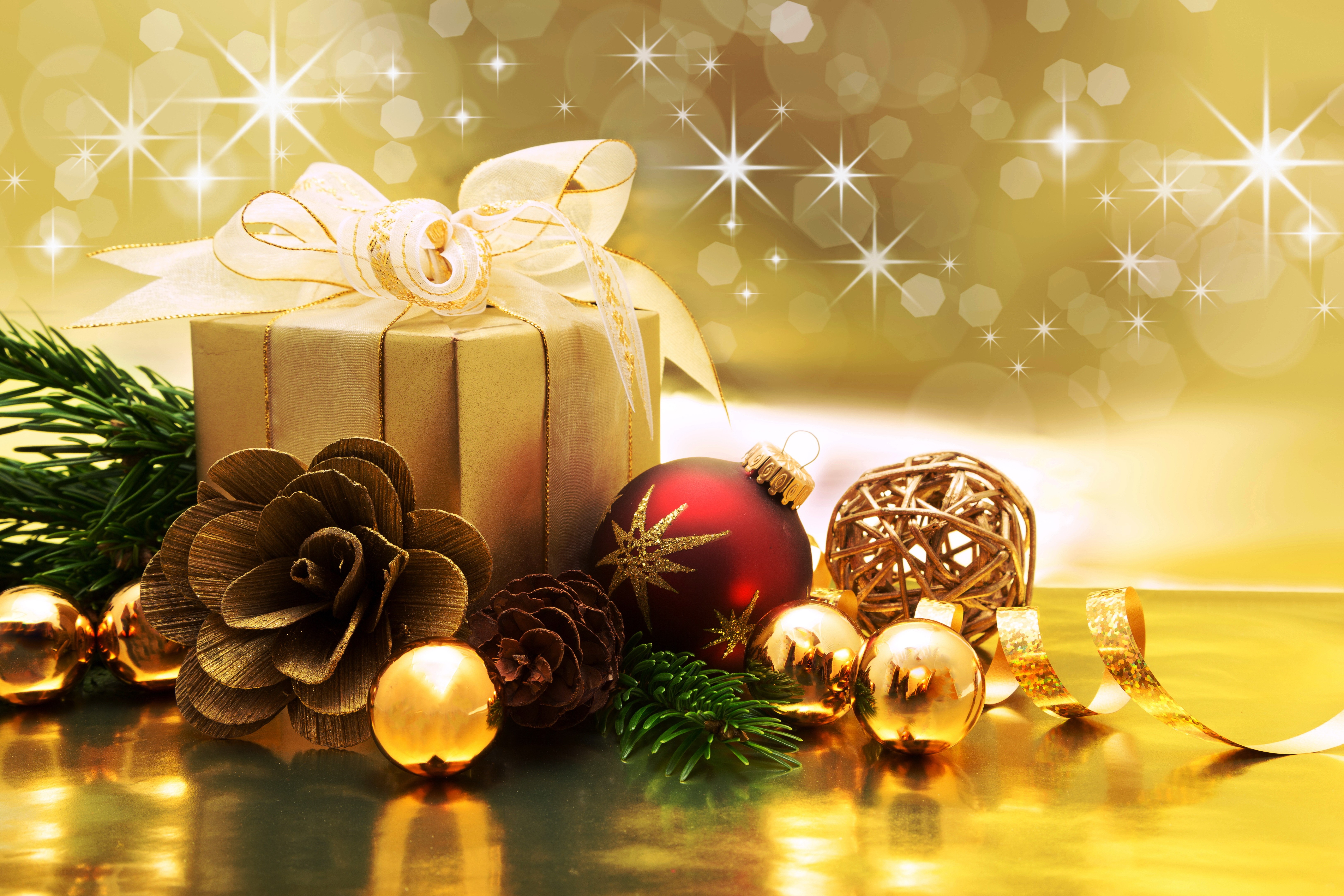Christmas gift with ornaments and pine branches HD Wallpaper
