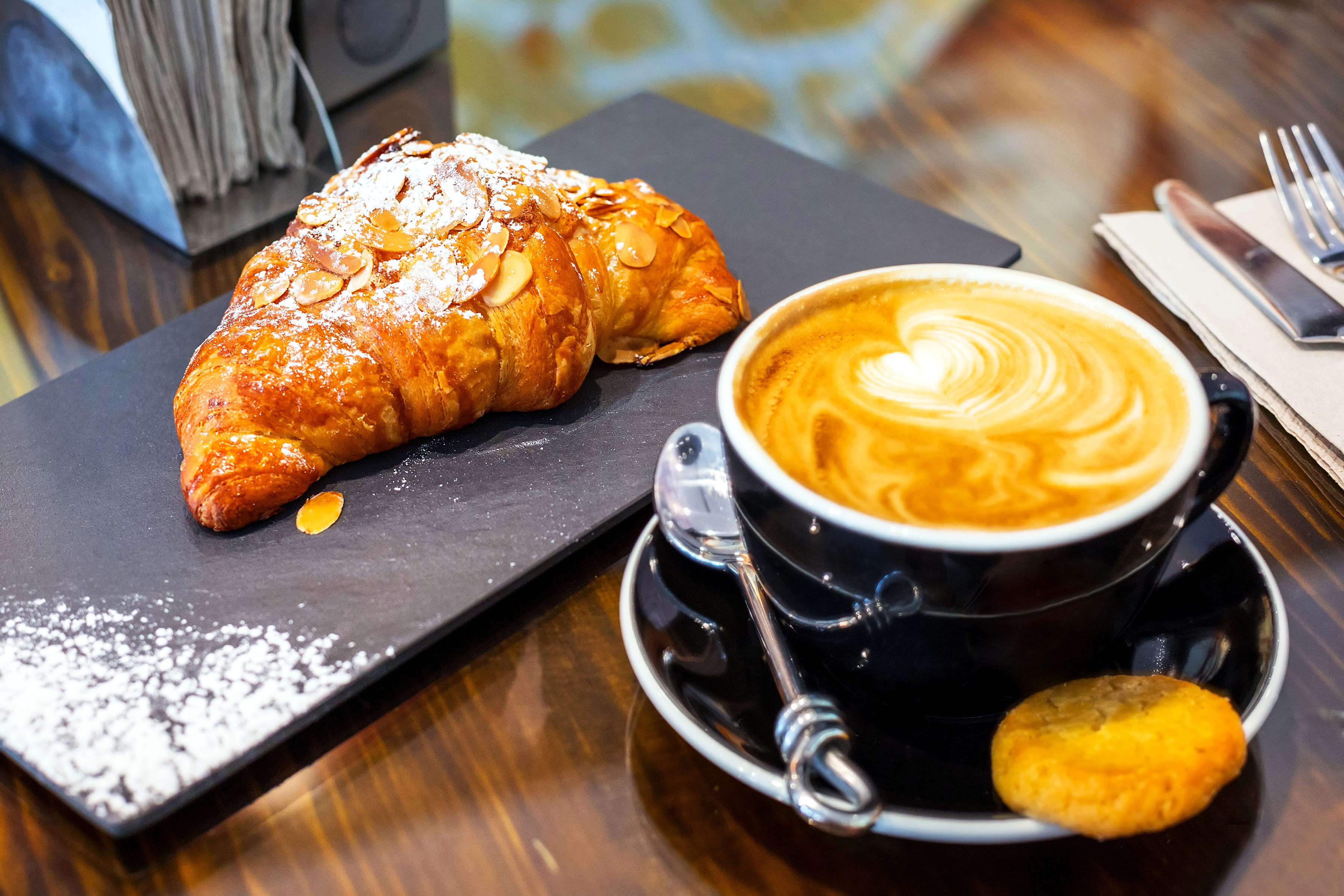 Almond croissant with cappuccino and cookie HD Wallpaper