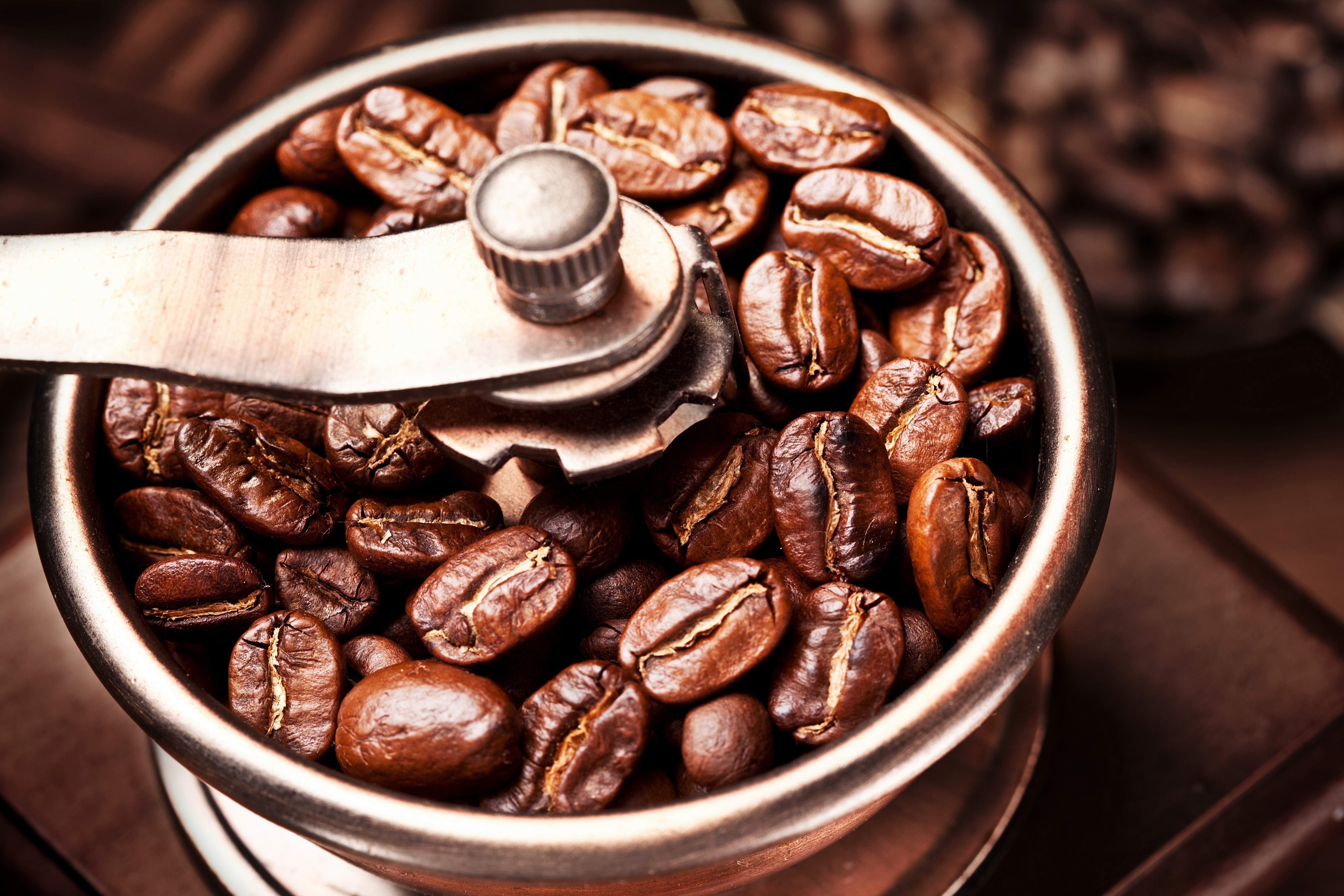 Coffee beans in a grinder HD Wallpaper