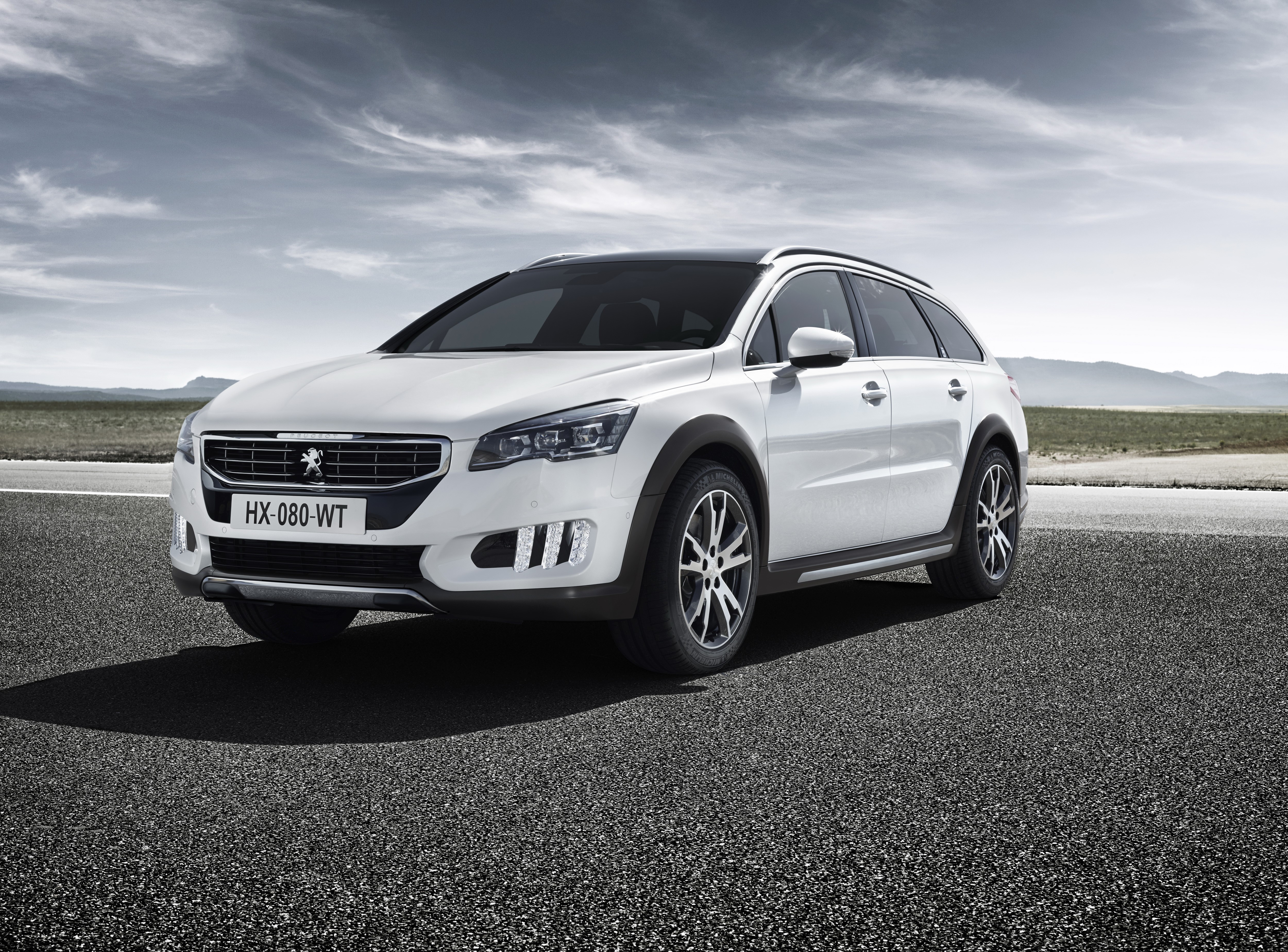 White Peugeot 508 RXH Hybrid4 parked on asphalt road HD Wallpaper