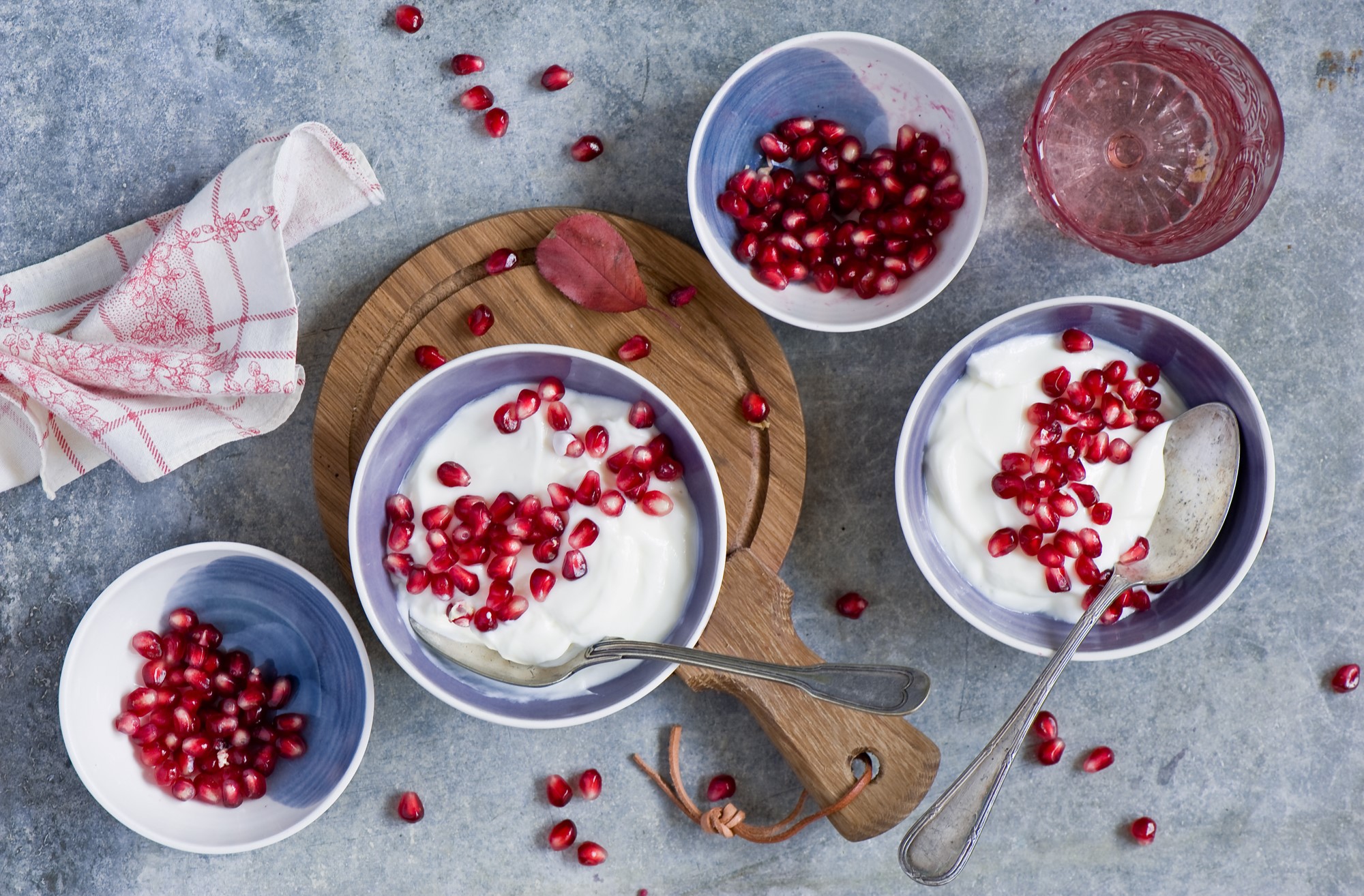 Yogurt with pomegranate seeds in bowls HD Wallpaper