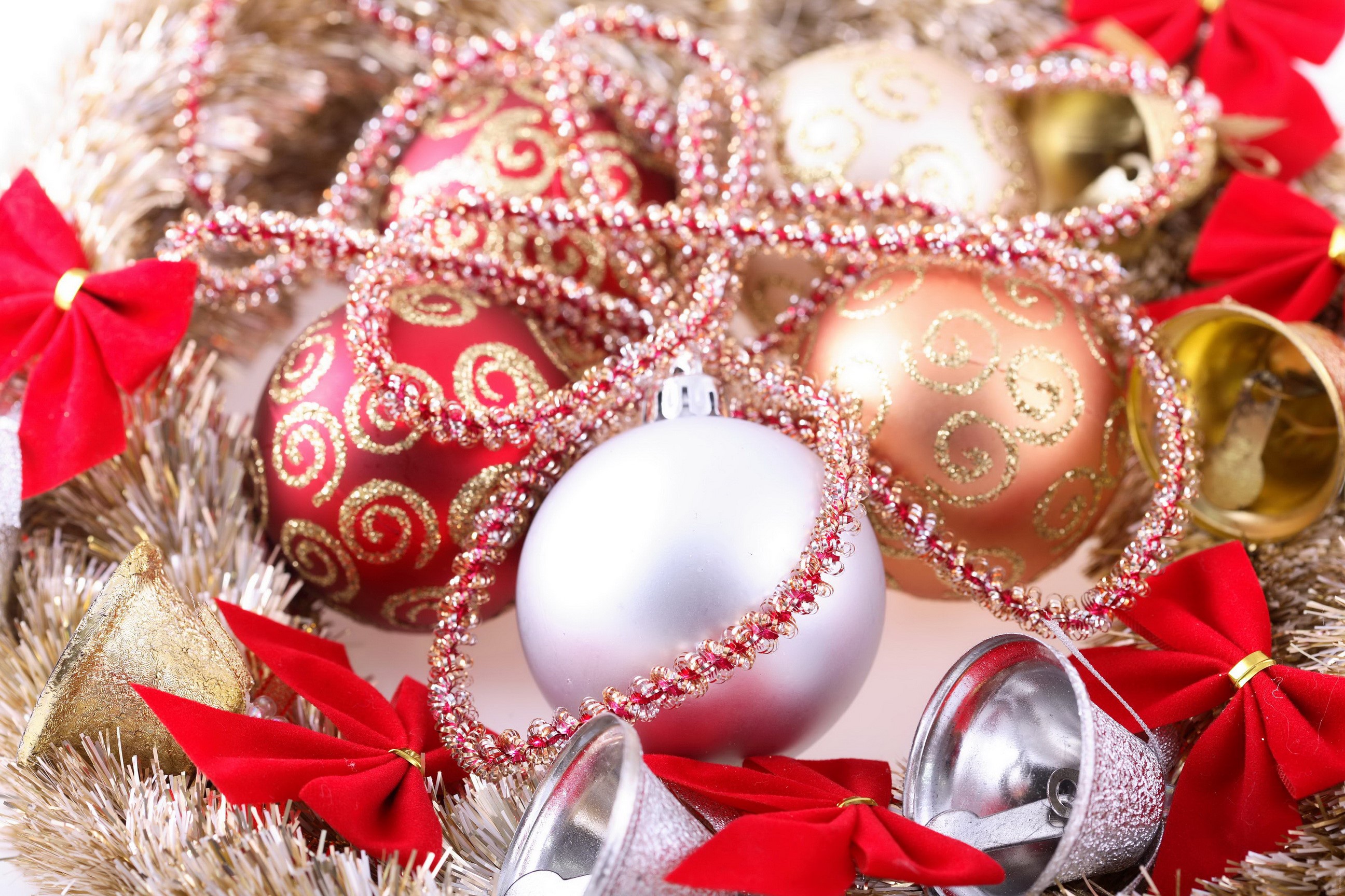 Christmas ornaments, bells, and tinsel HD Wallpaper