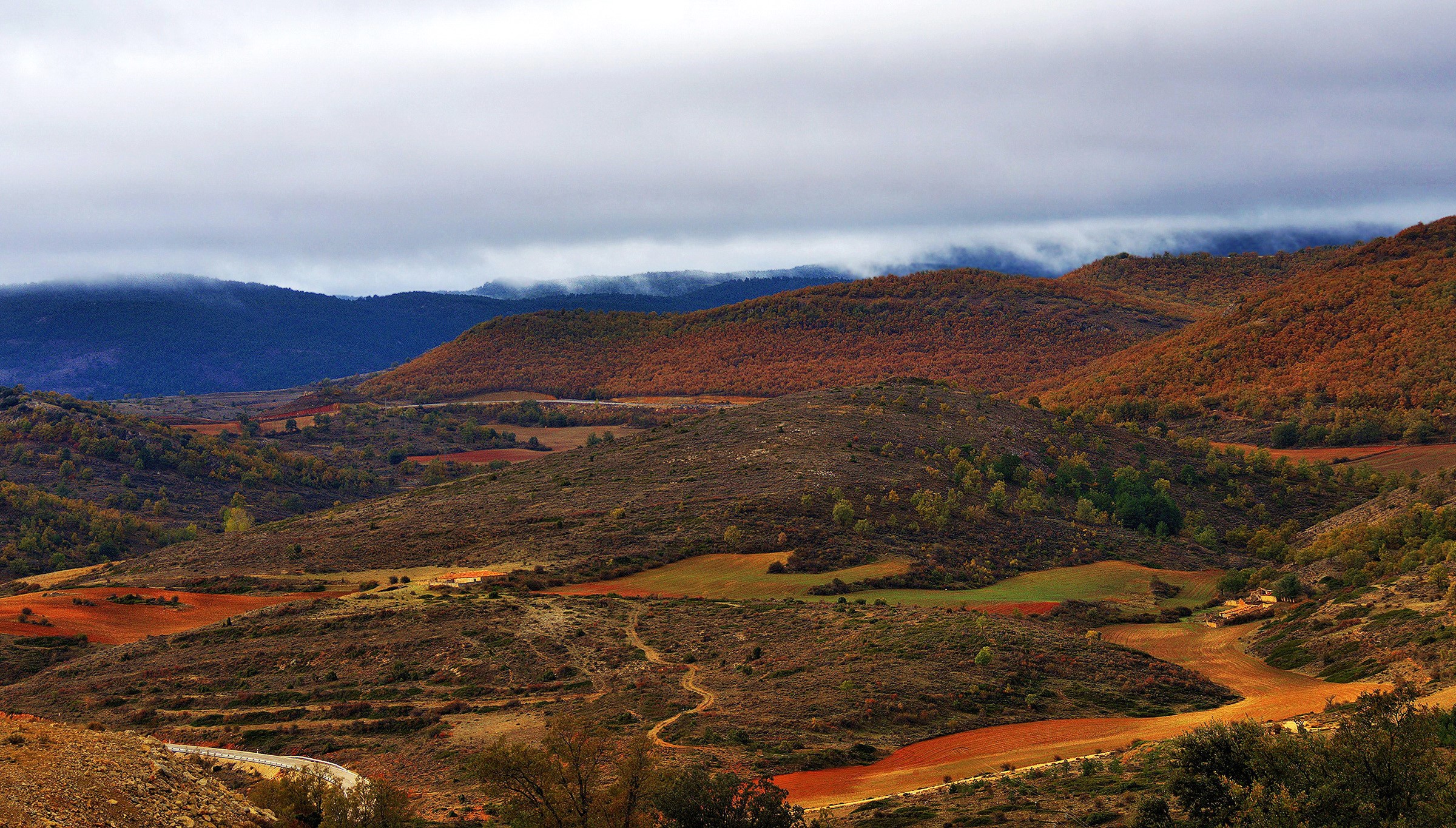 Autumn landscape with rolling hills and fields in Spain HD Wallpaper