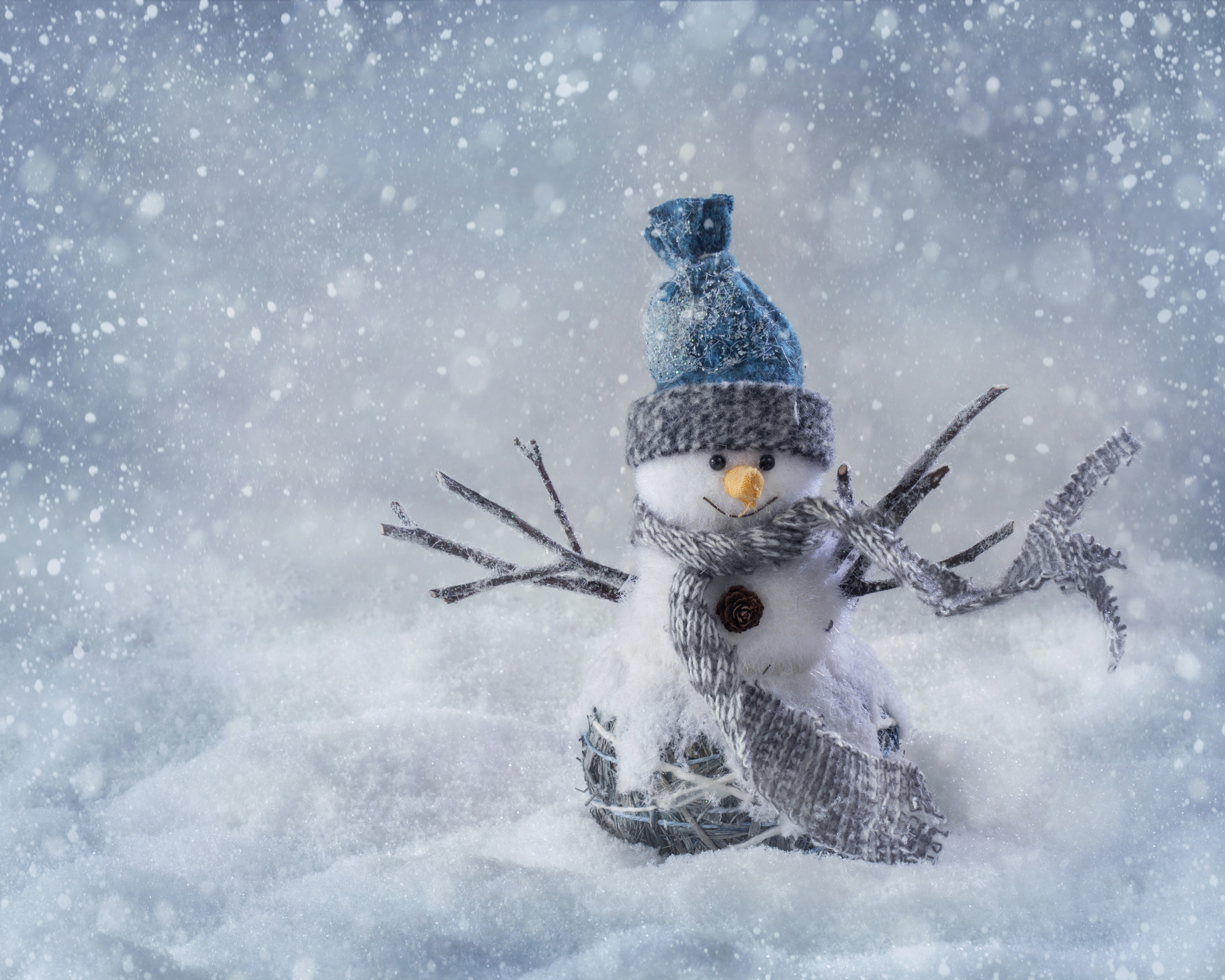 Snowman with blue hat and scarf in snow HD Wallpaper