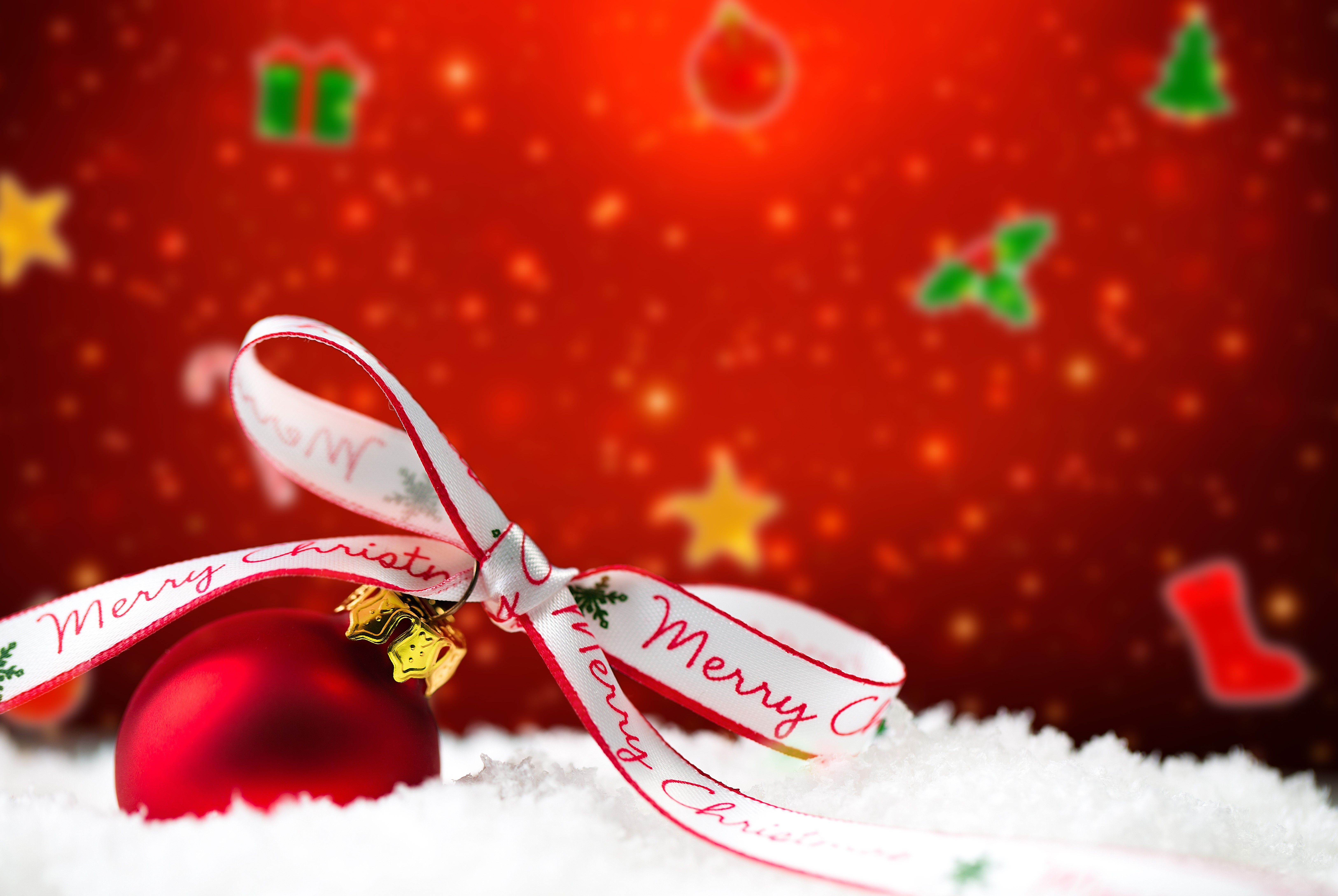 Christmas ornament with ribbon on snow HD Wallpaper