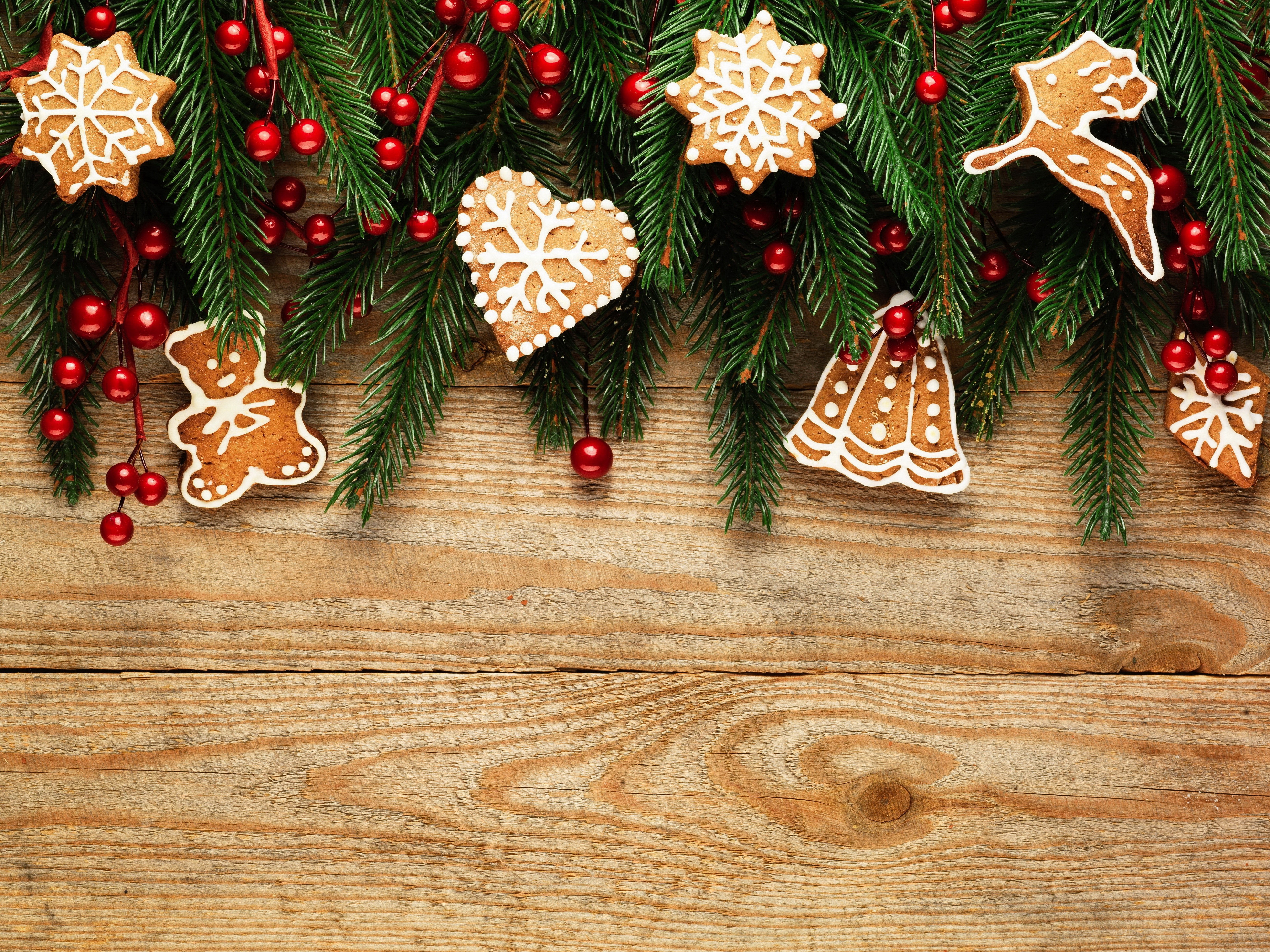 Christmas gingerbread cookies and fir branches on wood HD Wallpaper
