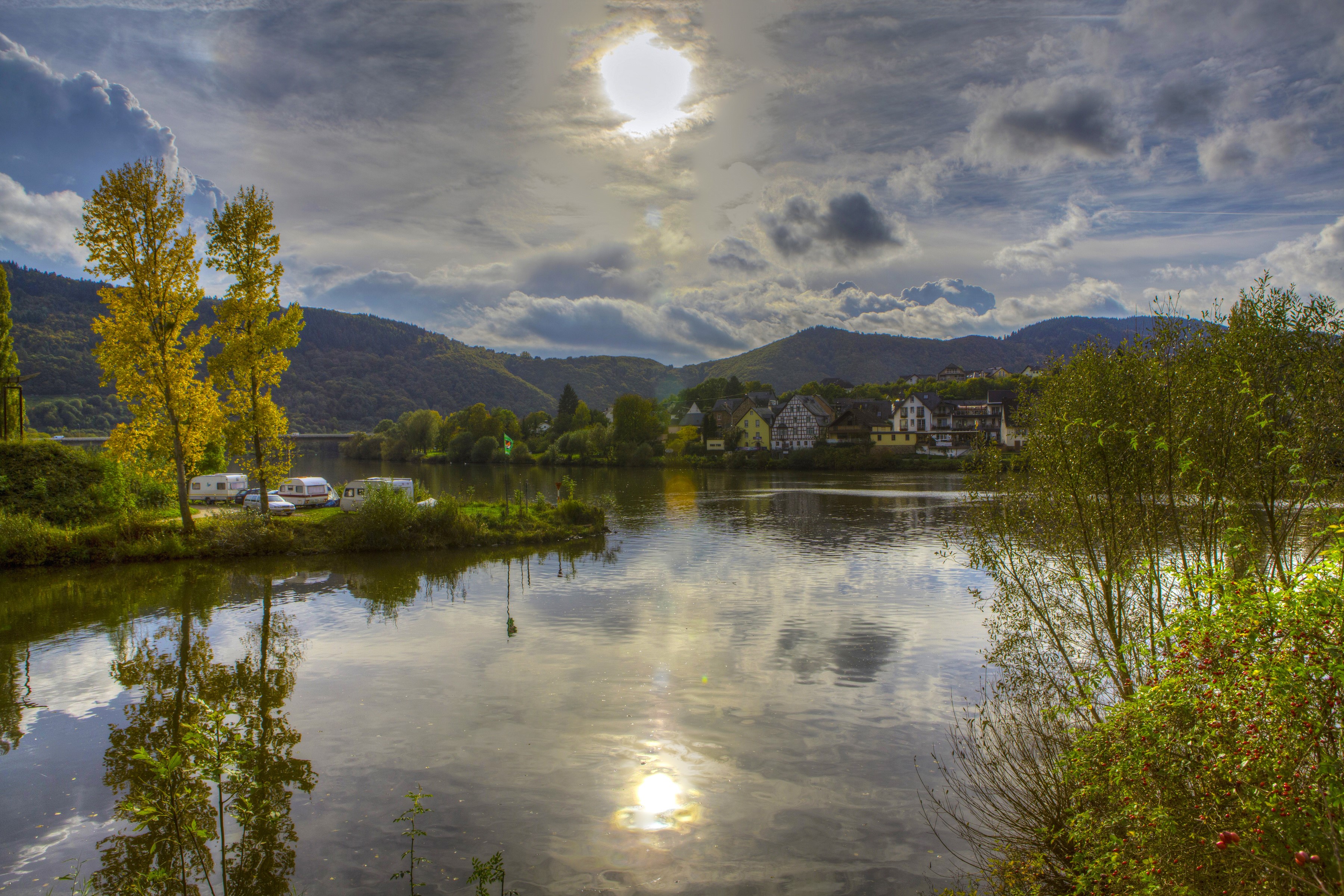 River with trees and village in Ulmen, Germany HD Wallpaper