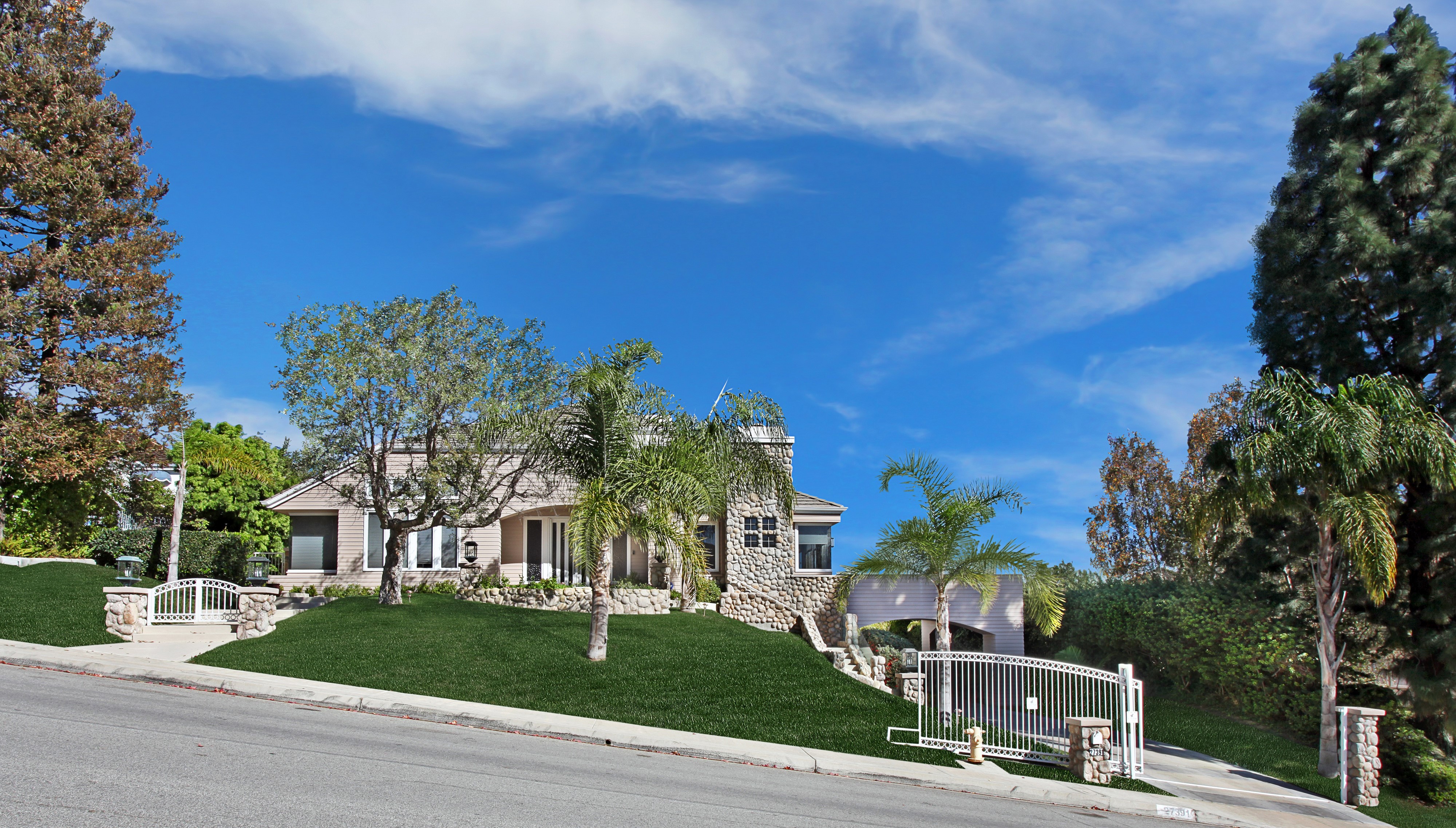 House with lawn and trees on a street HD Wallpaper