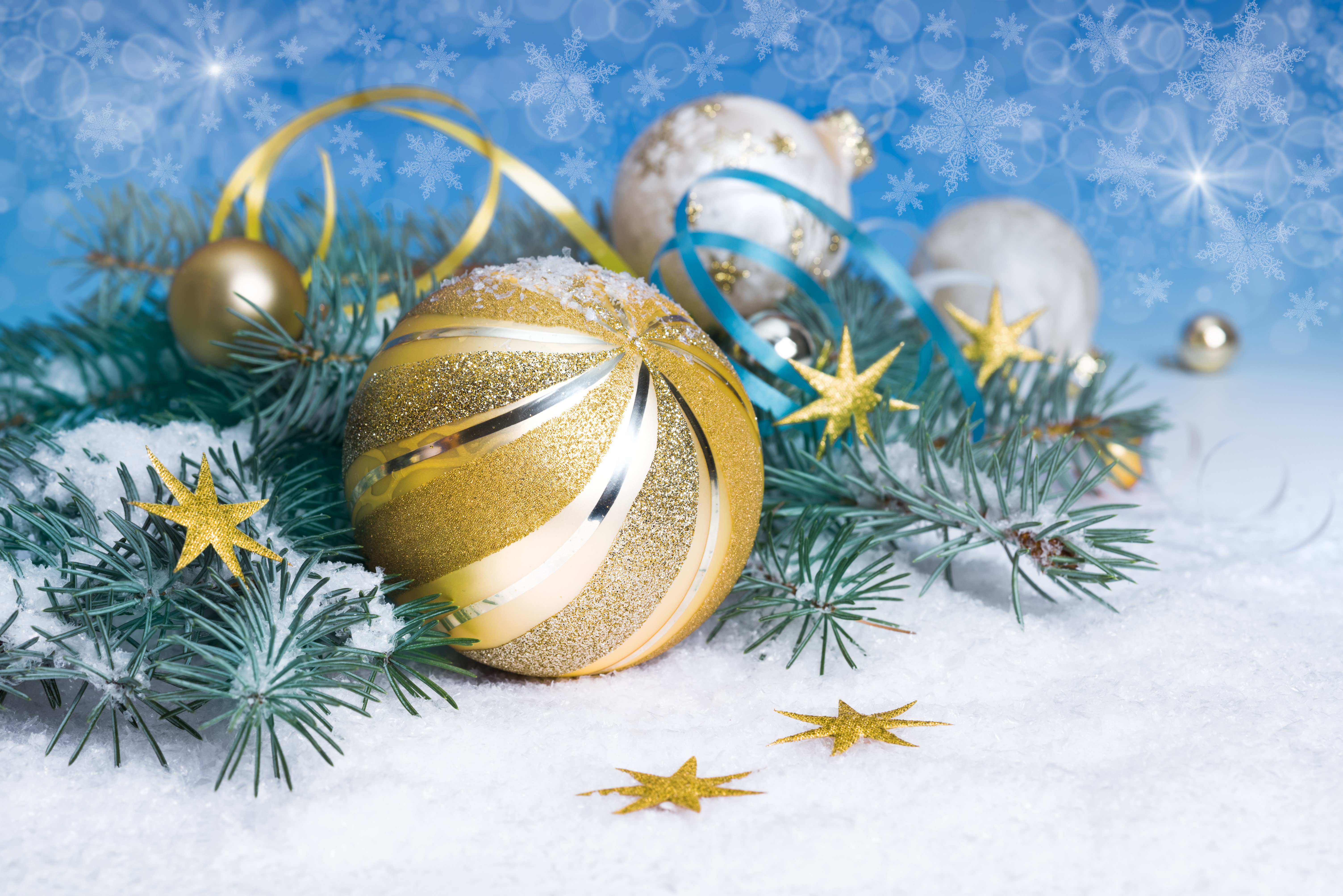 Christmas ornaments on snowy pine branches with snowflakes HD Wallpaper
