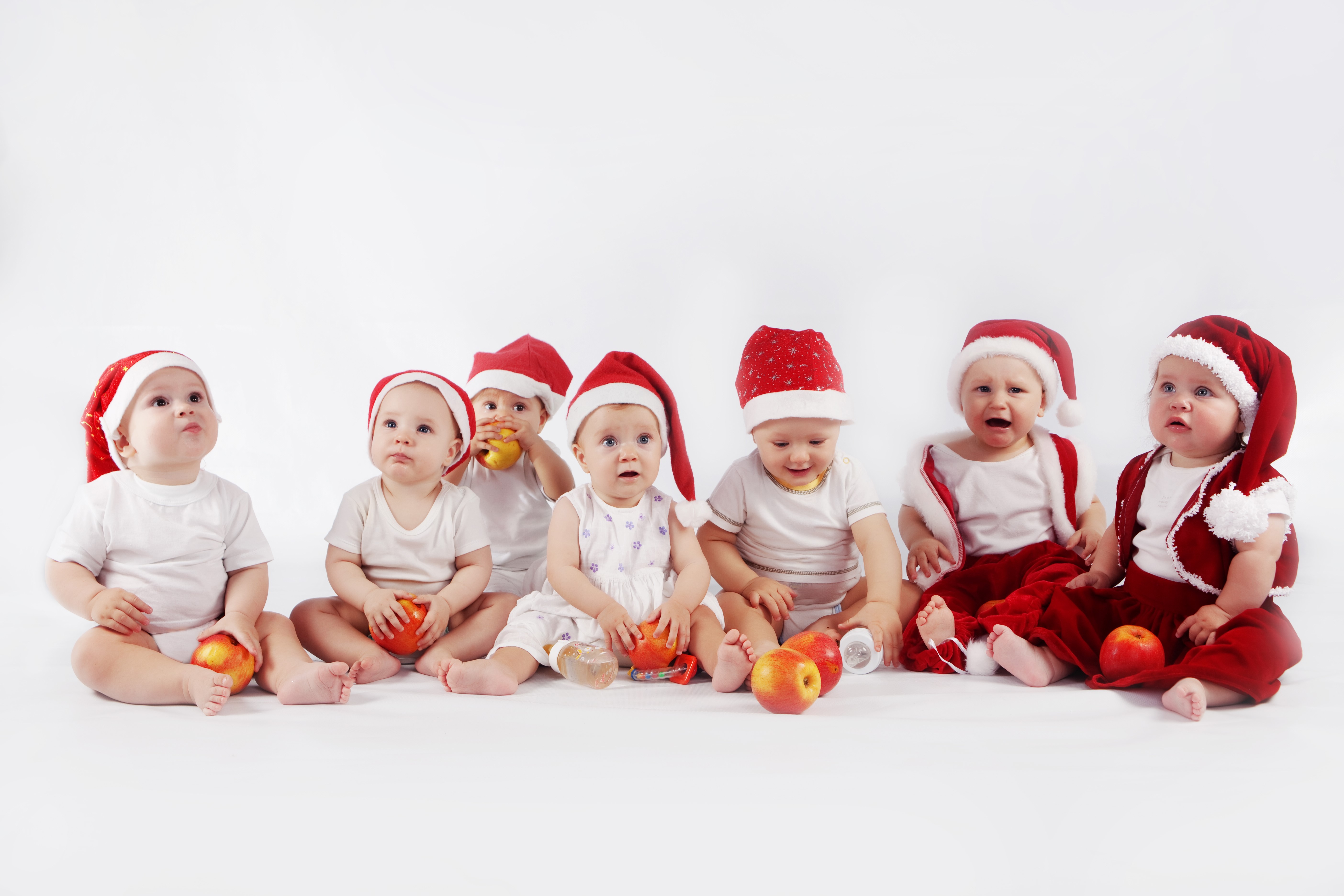 Babies in Santa Hats with Apples HD Wallpaper