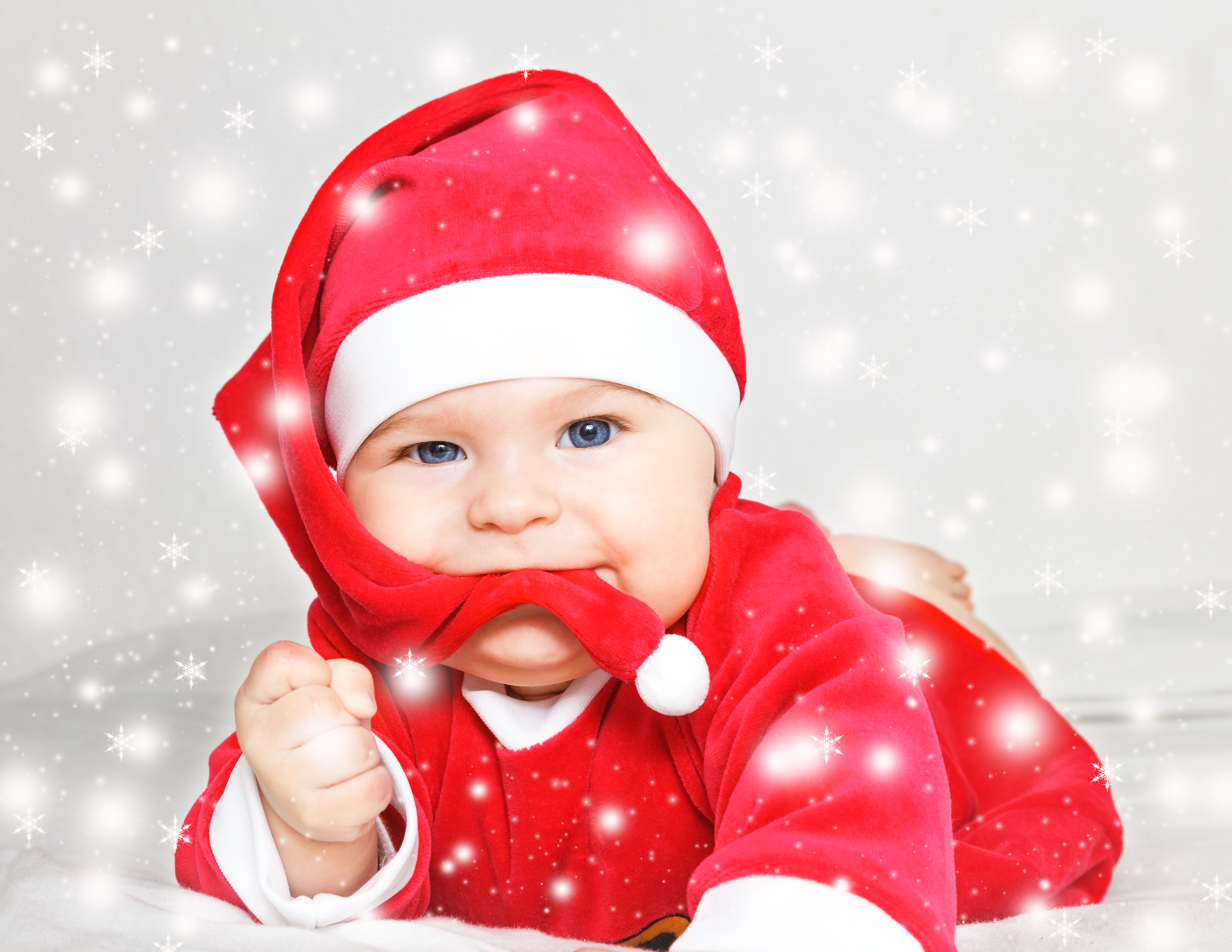 Baby in Santa costume with snowflakes HD Wallpaper